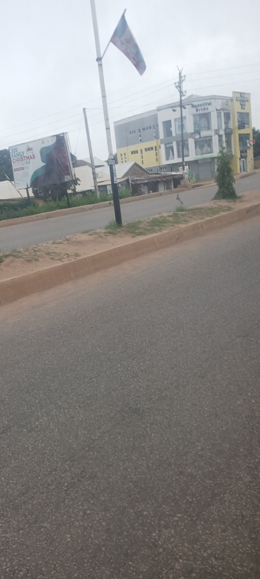 Morning drive through Jos streets captured in motion-blurred sequence