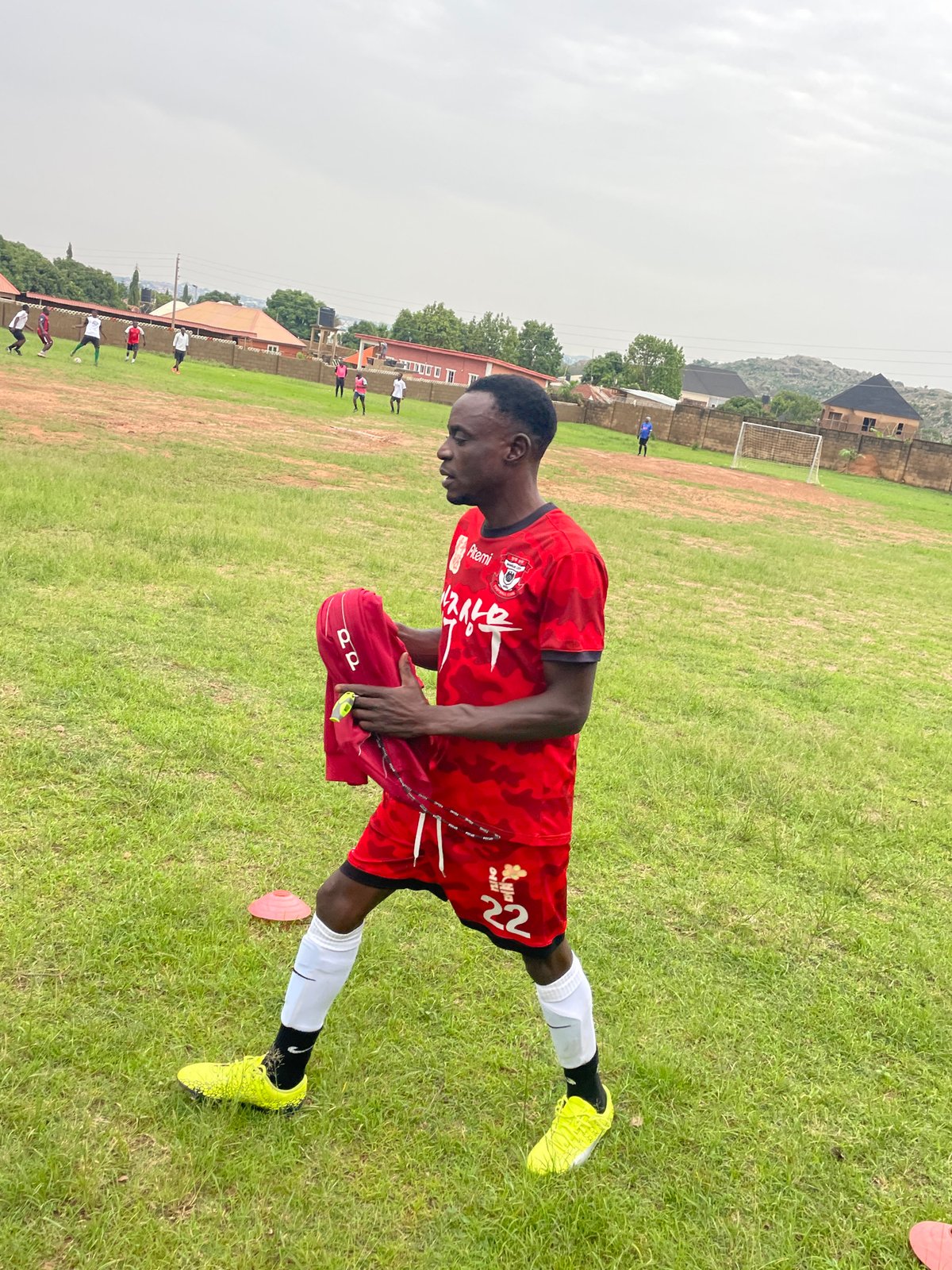 Soccer practice session on grassy field in Jos Nigeria