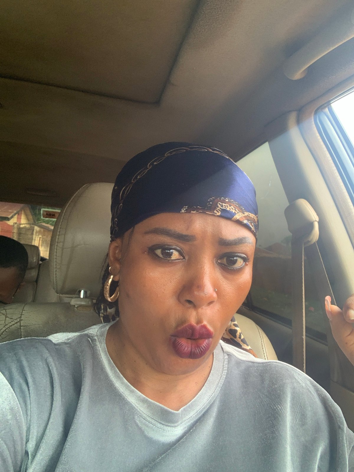 Woman takes car selfies in Sabon Tasha, Nigeria