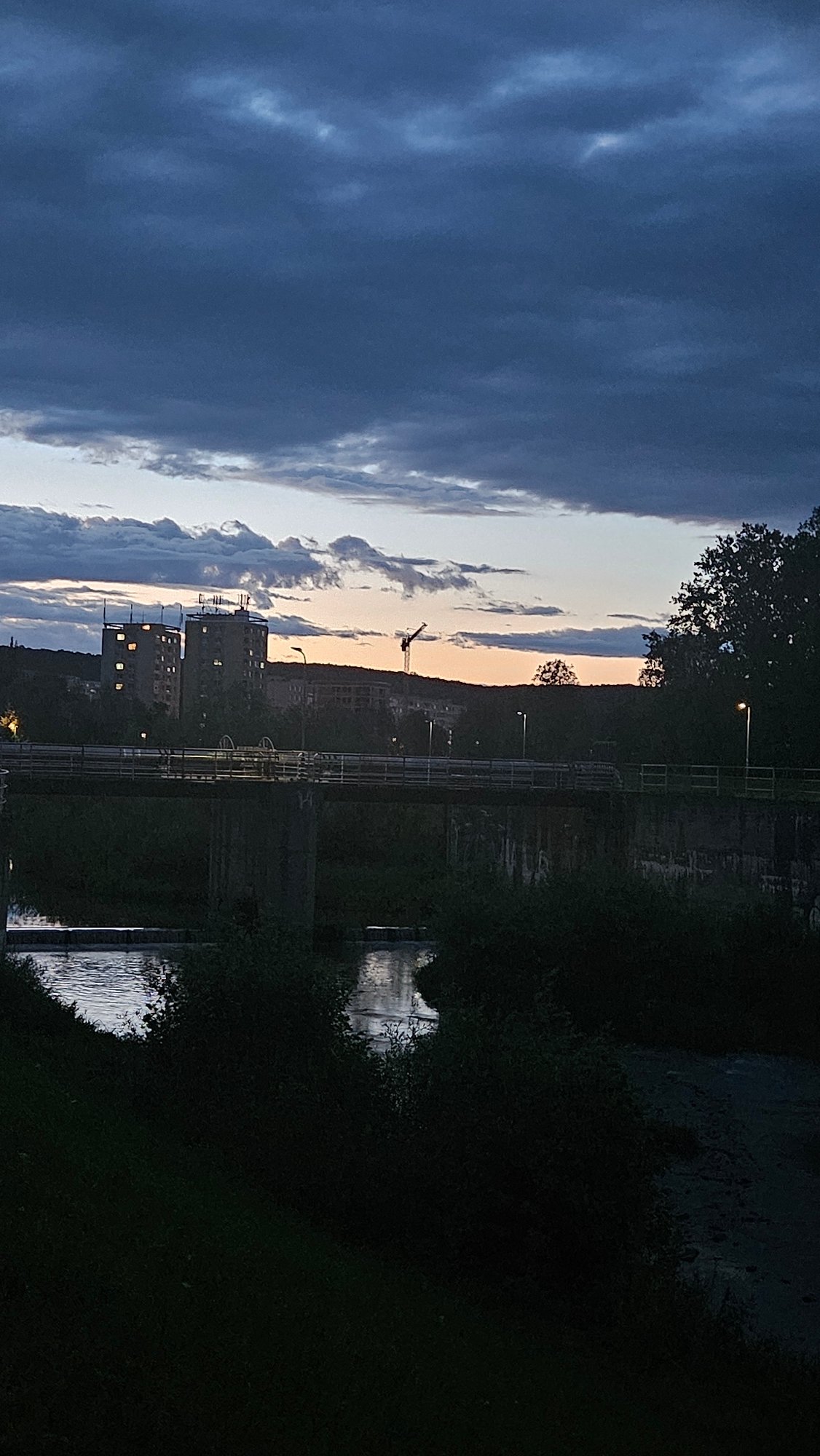 Dusk settles over Prešov's riverfront and residential streets