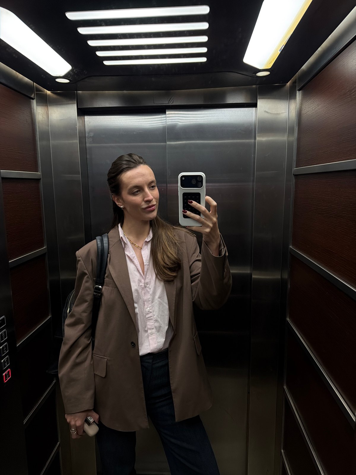 Woman Takes Selfie in Elevator in Budva