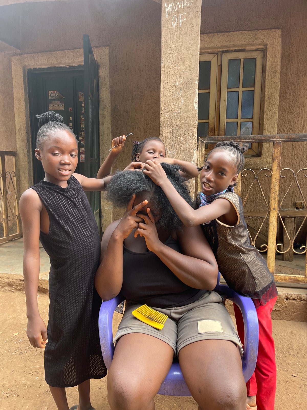 Hair braiding session documented in Akwanga, Nigeria