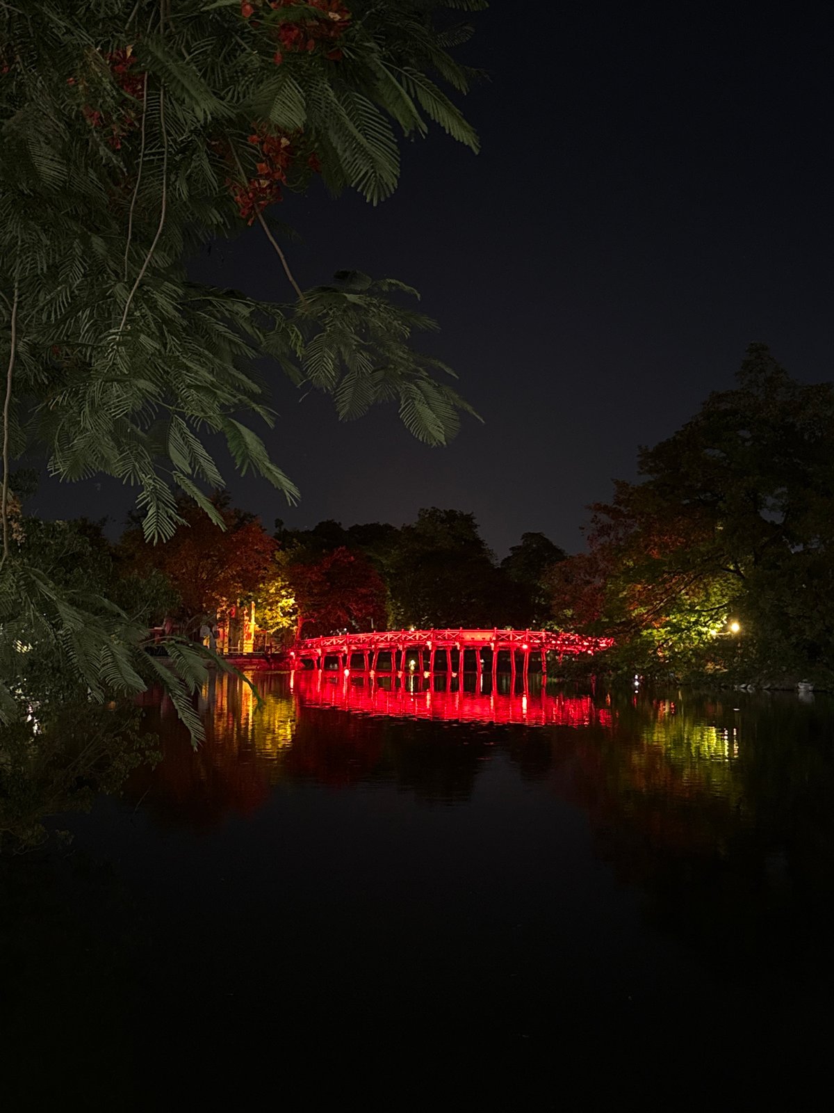 Evening stroll through Hanoi: lit landmarks and café drinks