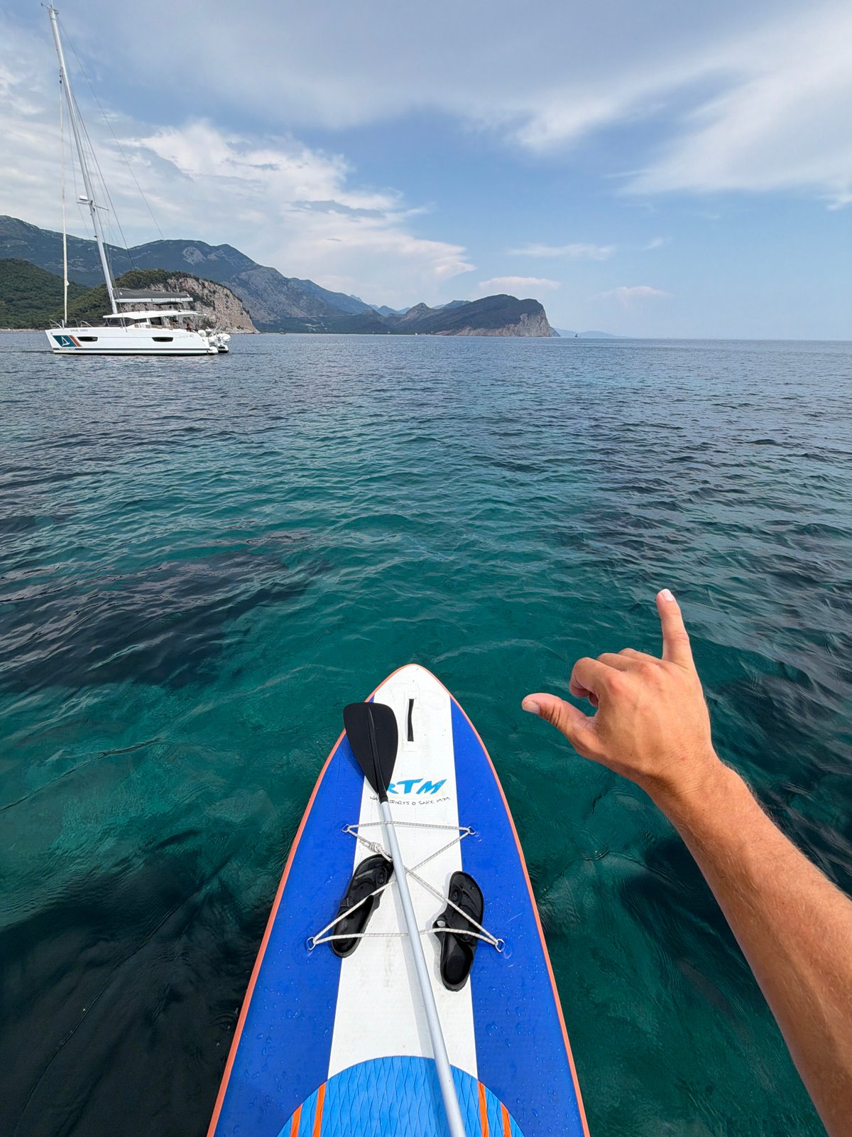 Paddleboarding the Adriatic off Petrovac's rocky coastline