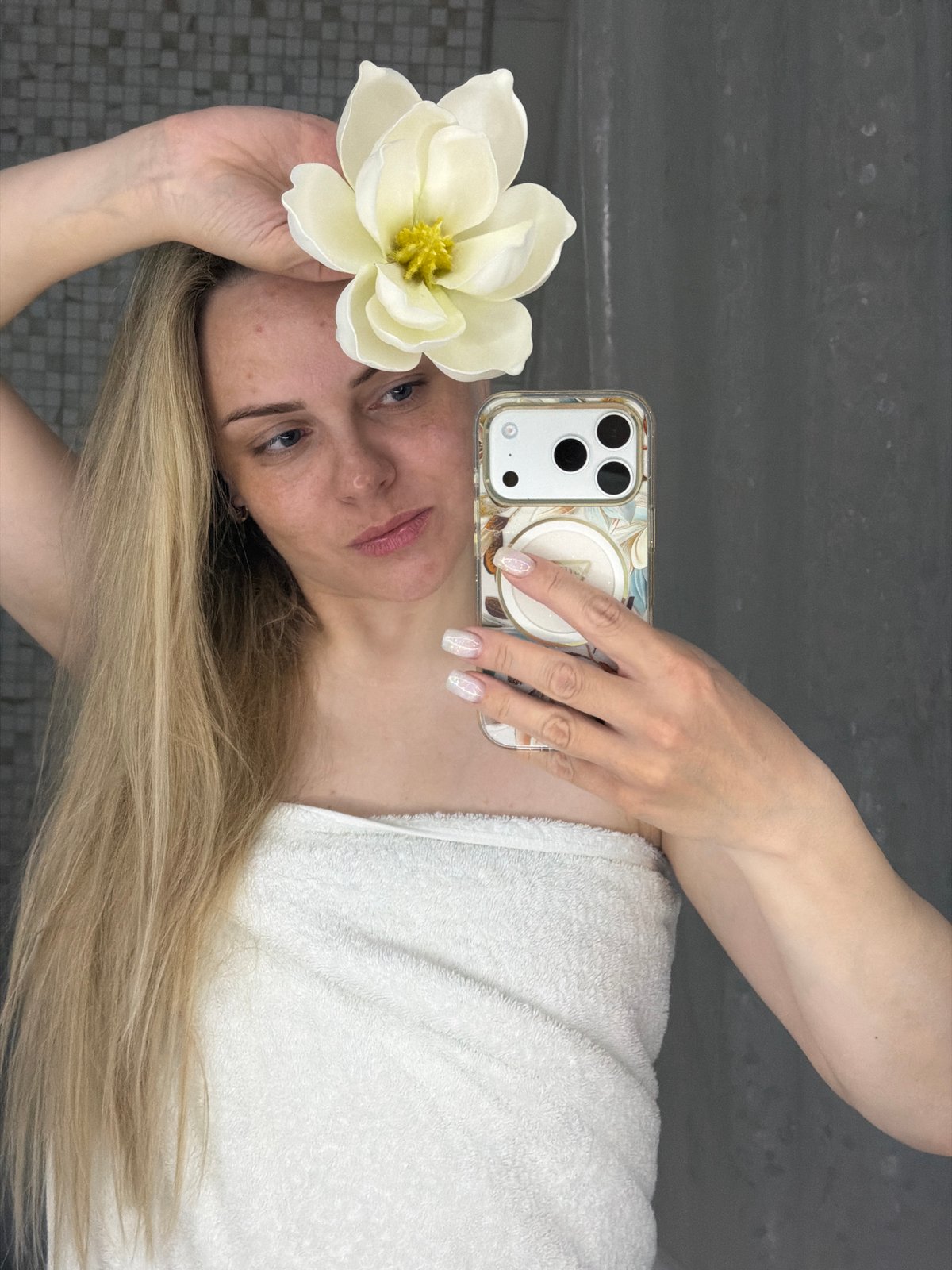 Woman takes bathroom mirror selfies in Votkinsk, Russia