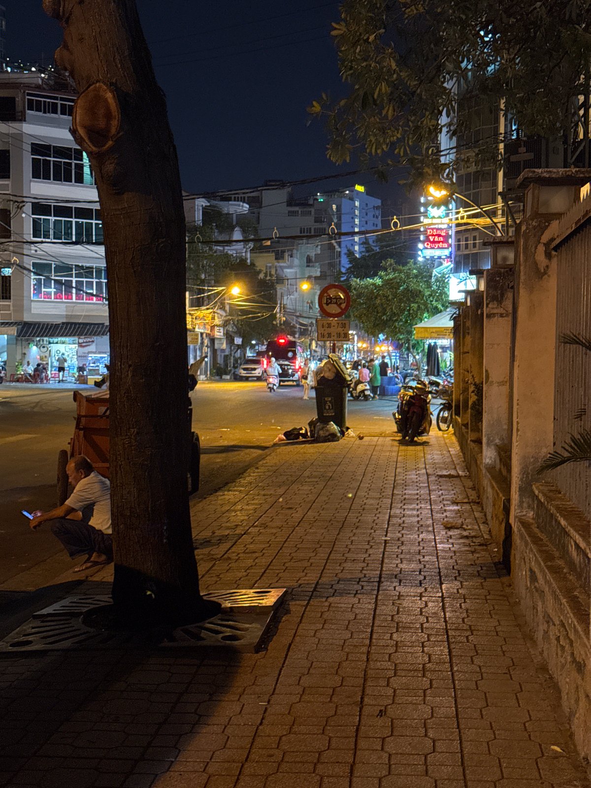 Nha Trang streets at night: buses, scooters, and city lights