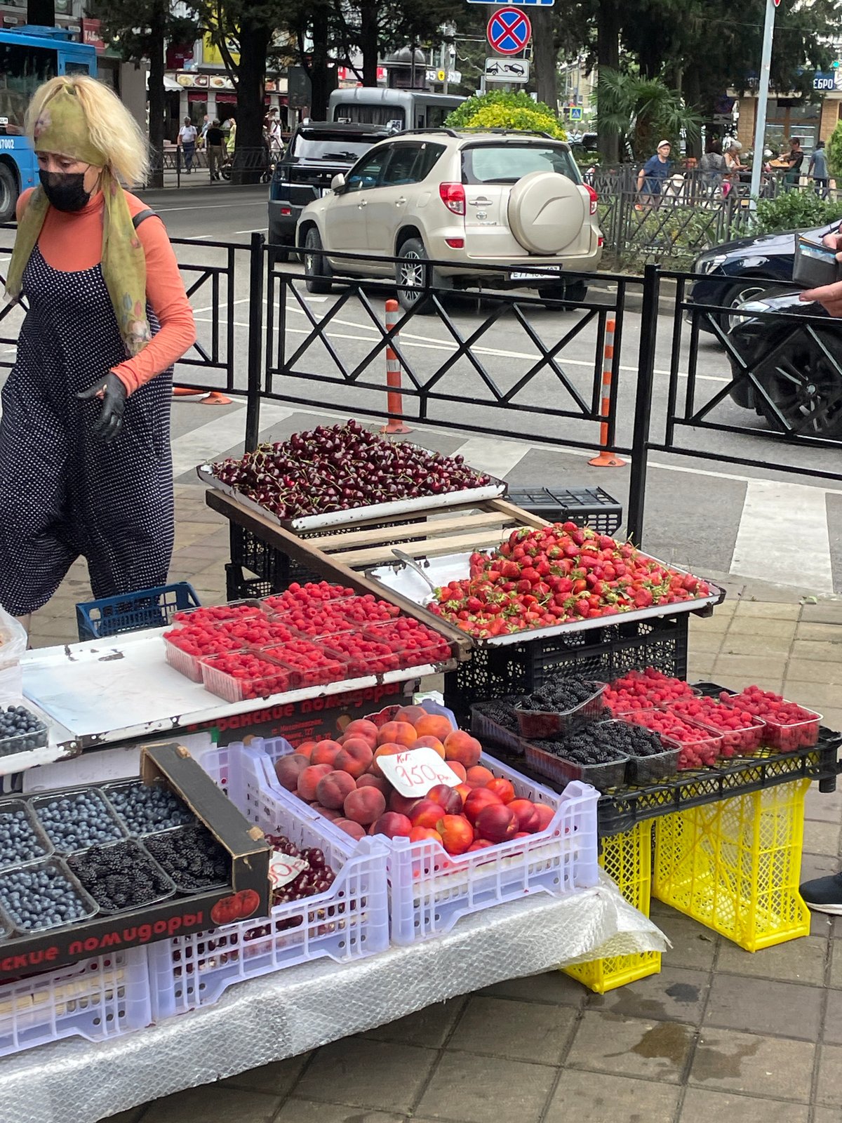 Fresh fruit stall on a Sochi sidewalk, summer market scene