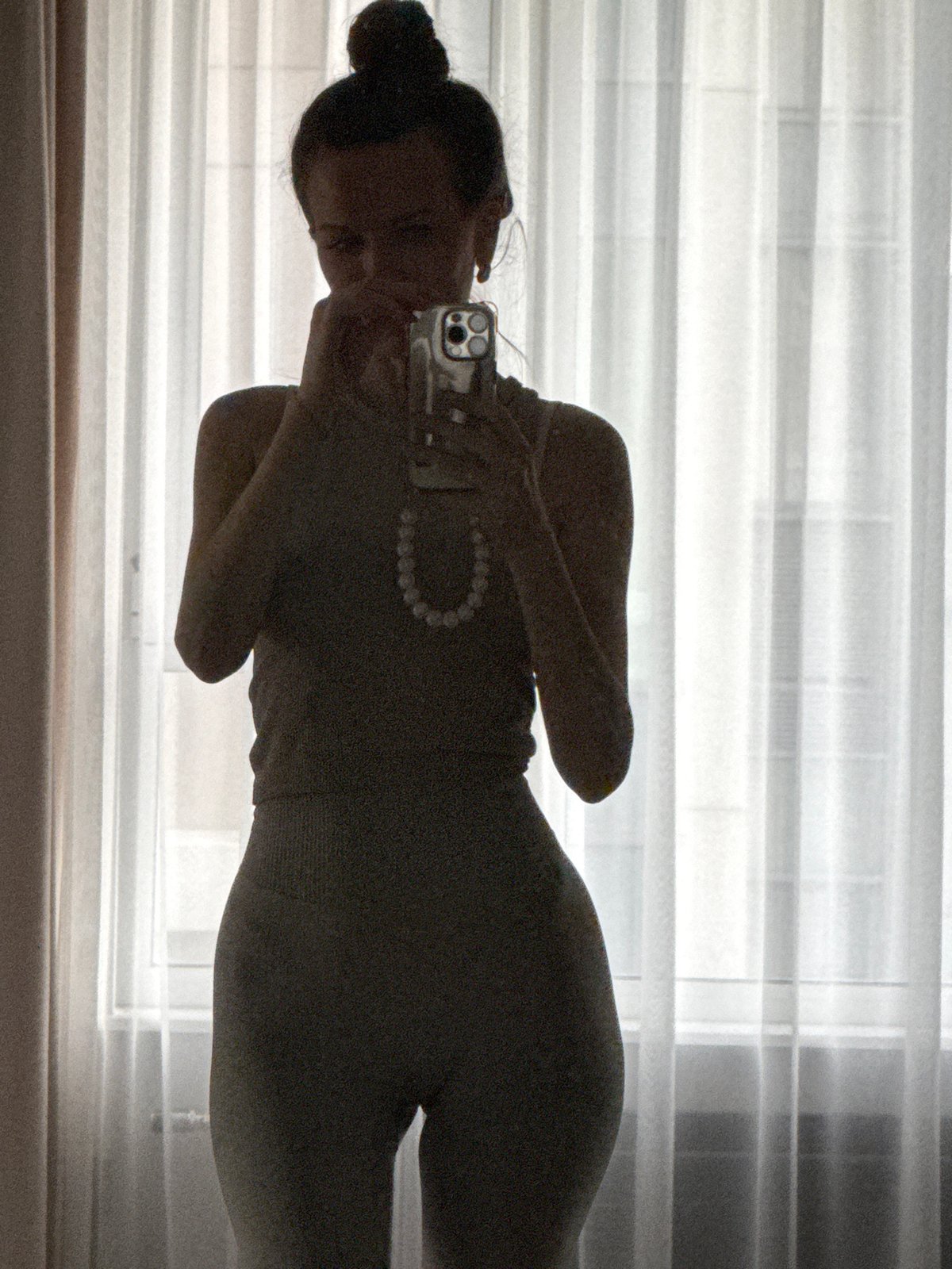 Mirror selfies captured in Khimki building during afternoon