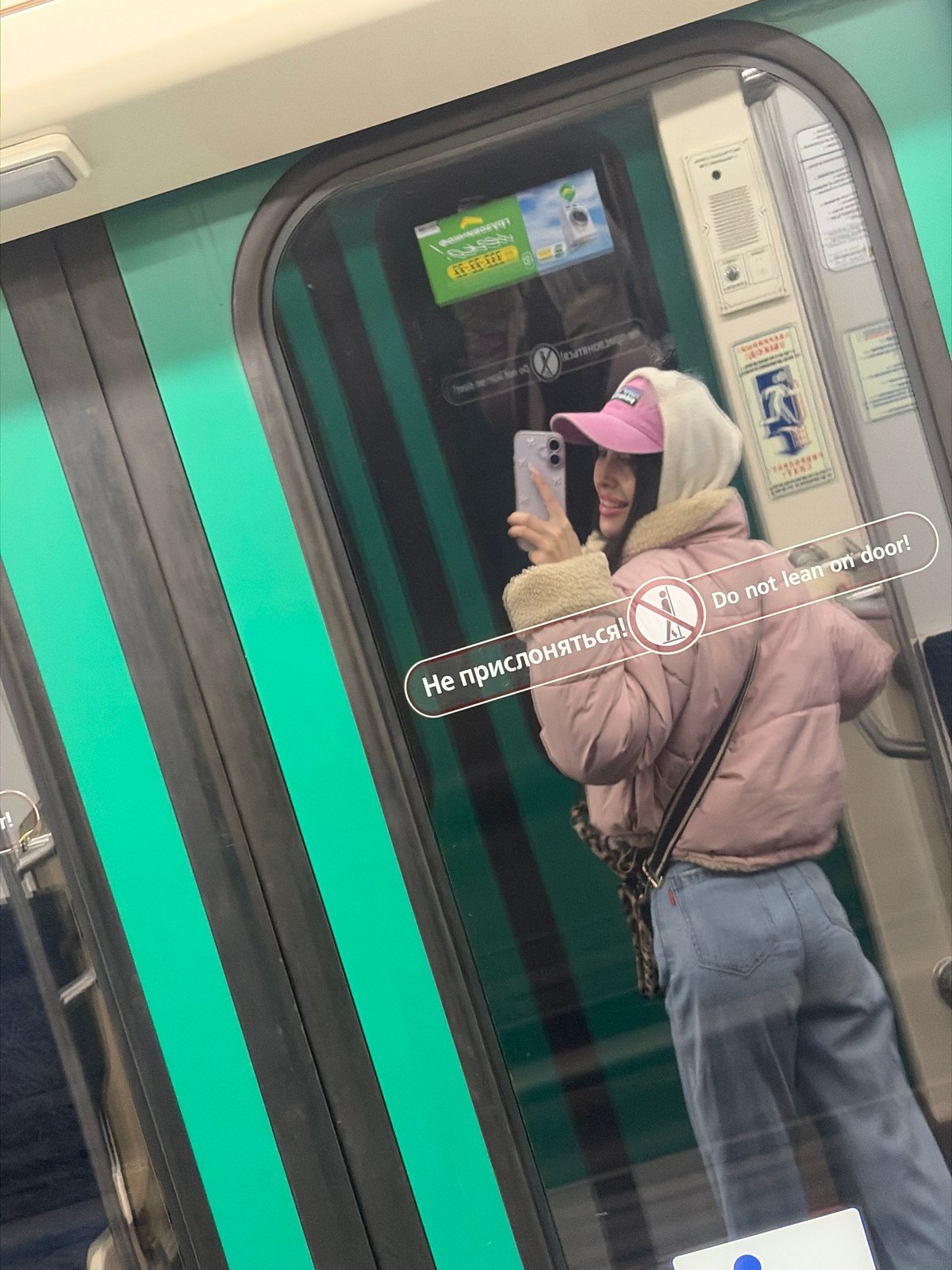 Woman Takes Selfies, Rests on Saint Petersburg Metro Train