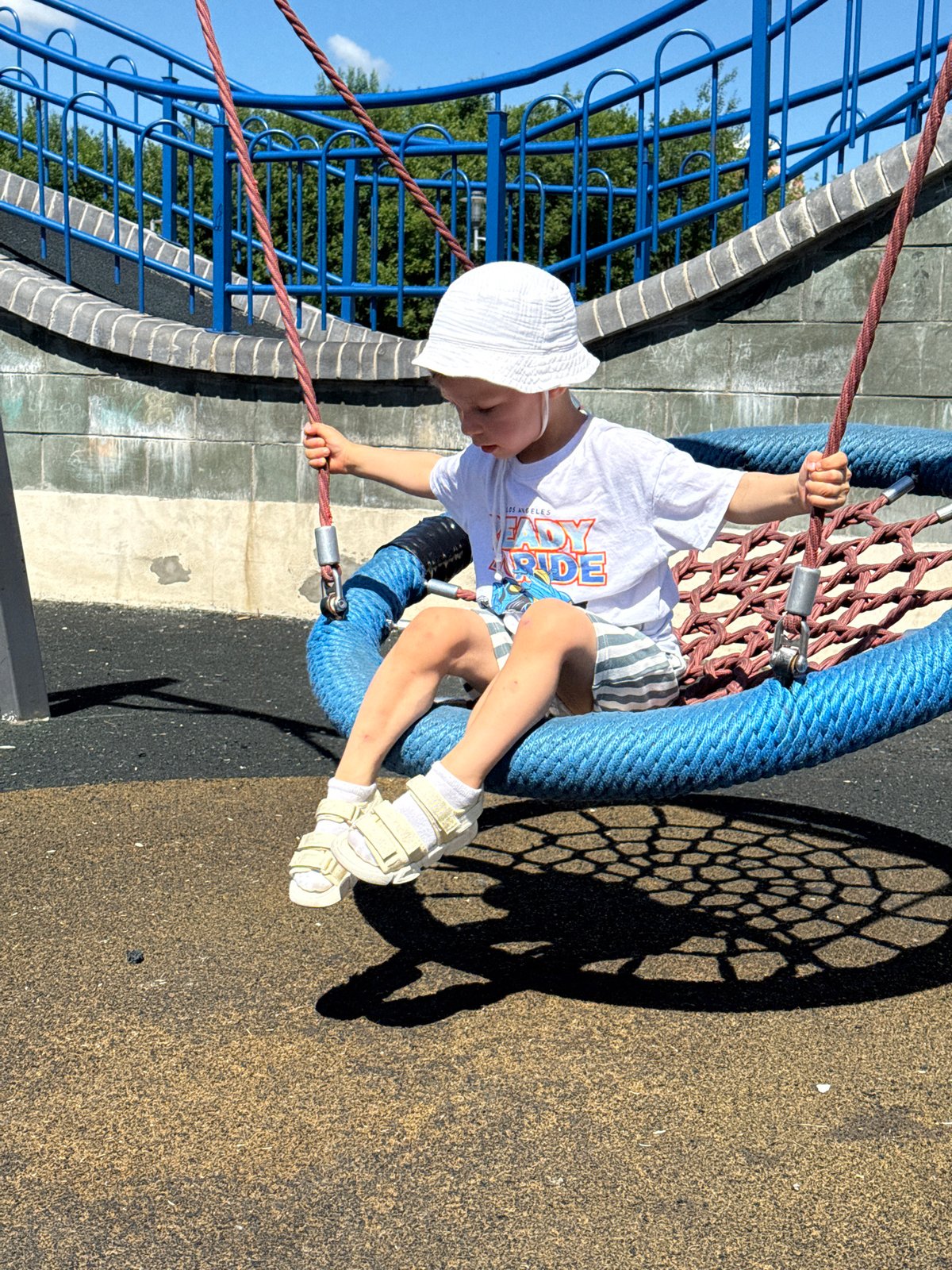 A sunny morning exploring rides and play structures at an amusement park