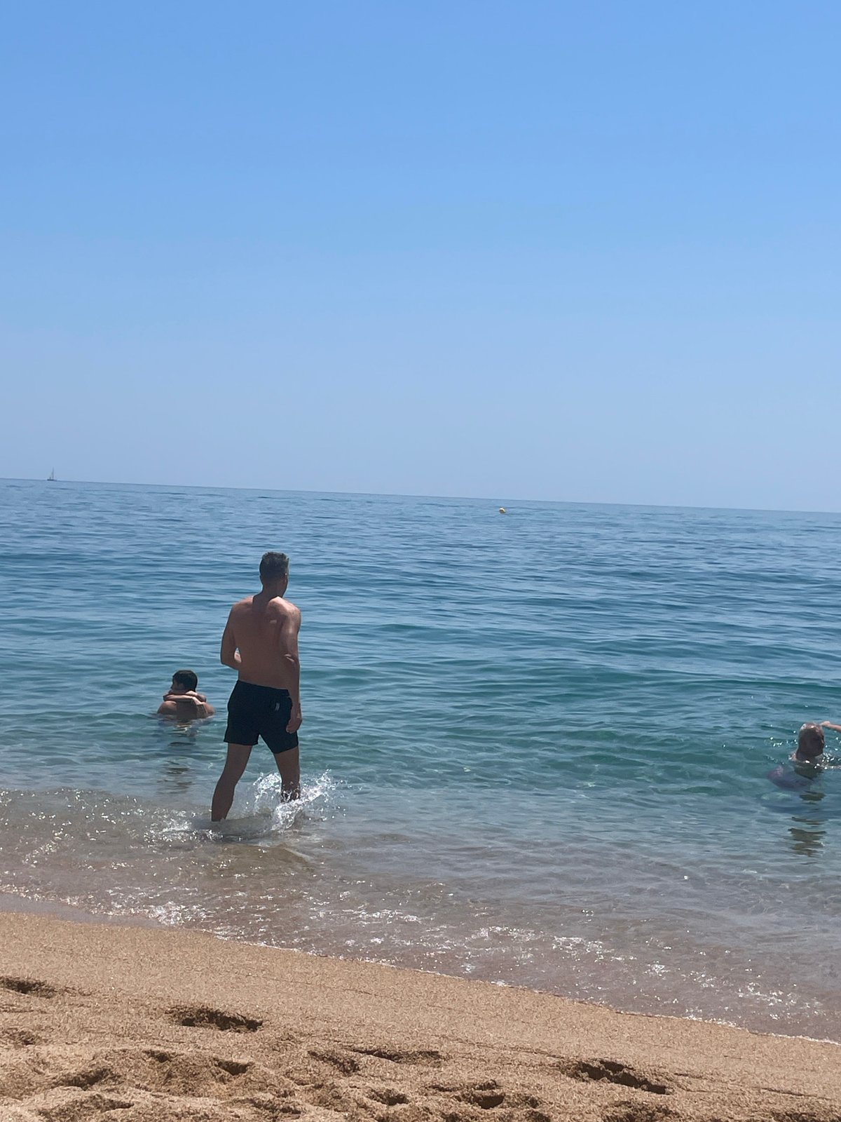 Lazy summer morning on the beach at Canet de Mar
