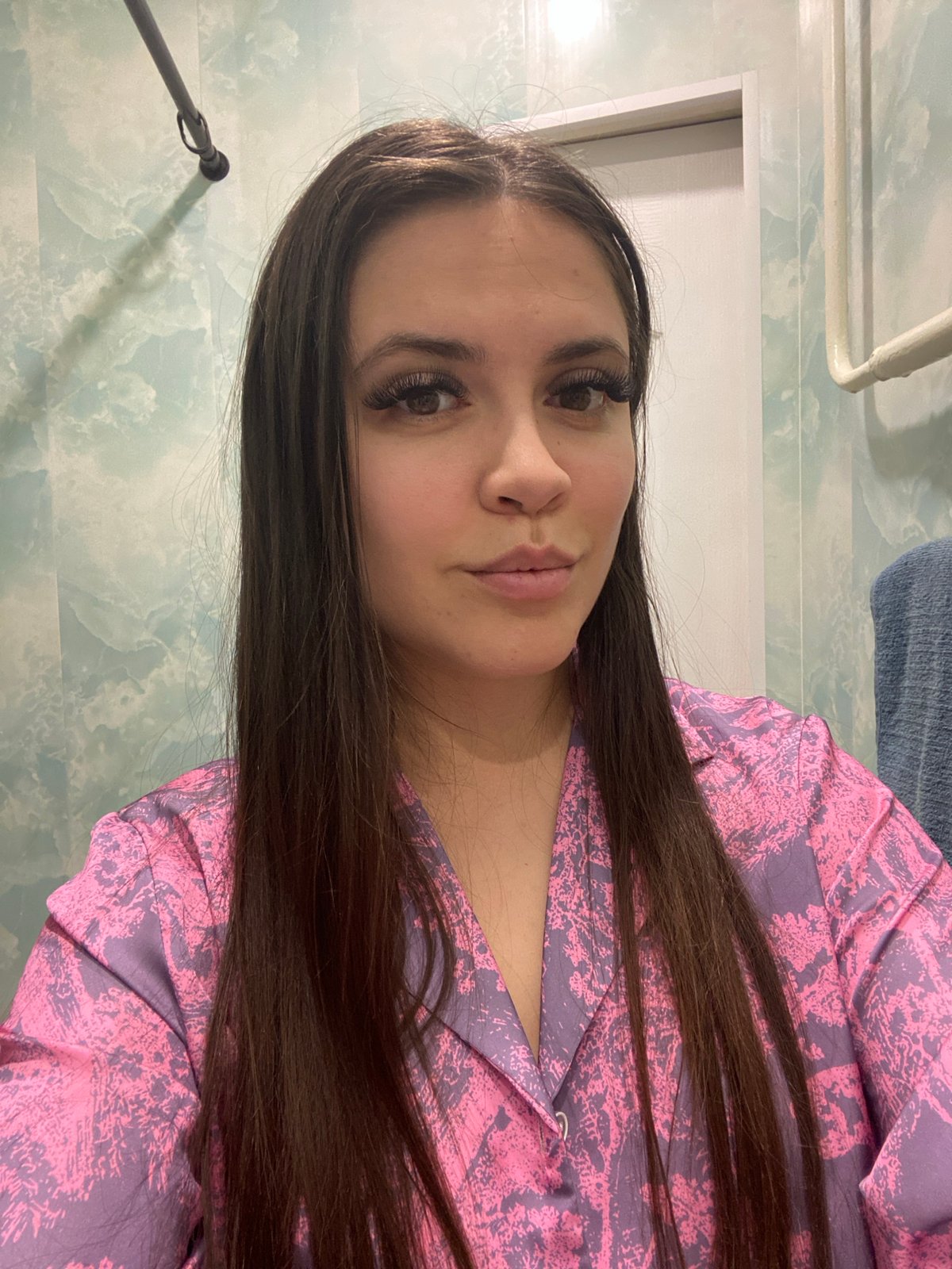 Woman takes late-night selfies in bedroom in Chaikovsky