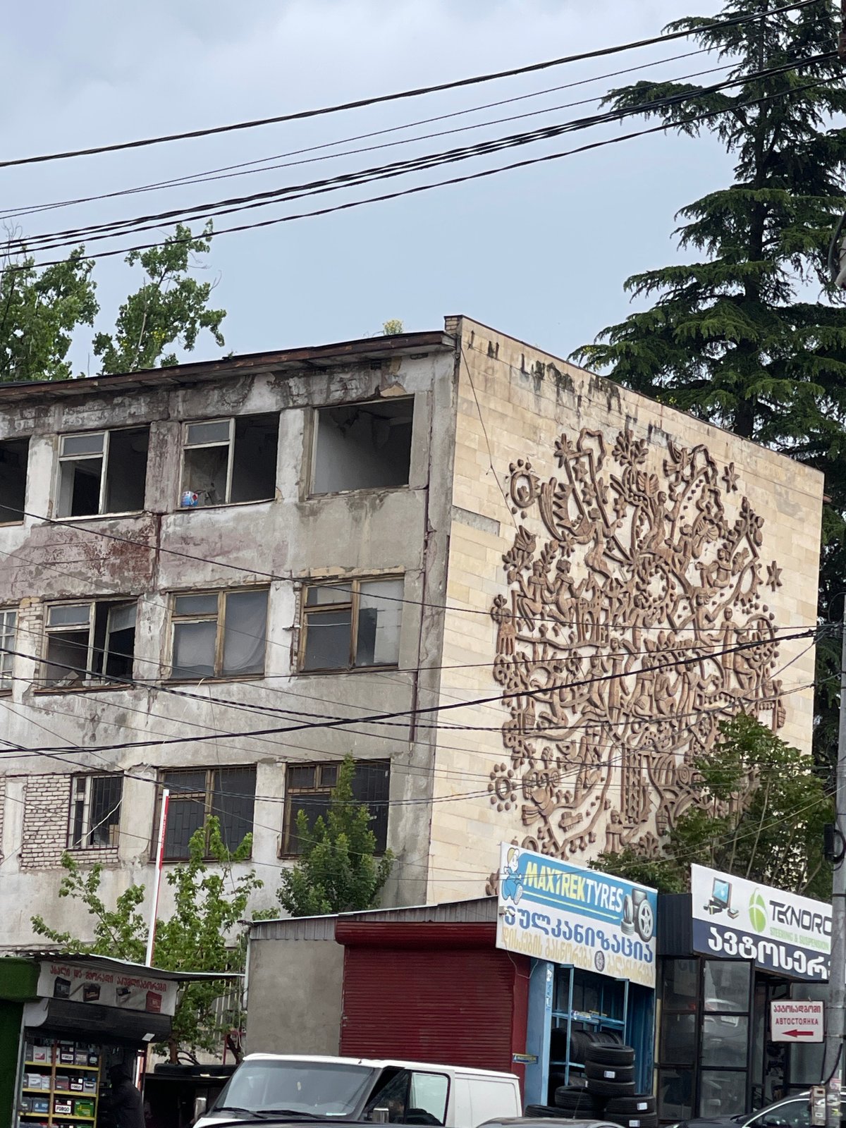 Witness documents damaged cars, buildings, auto shops in Tbilisi