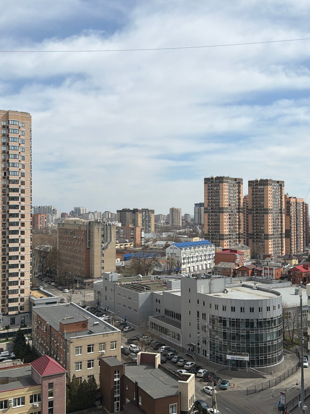 Aerial views document residential streets and parking in Azov