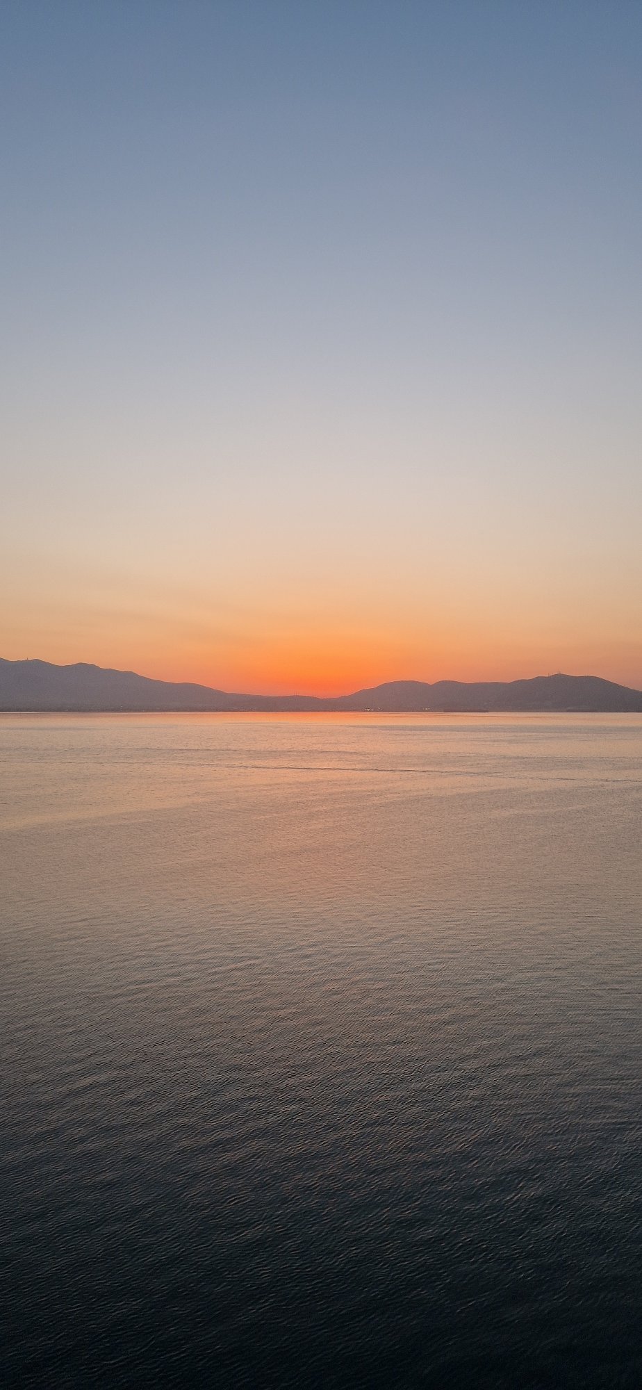 Sunset to twilight from a tanker deck off Salamina, Greece