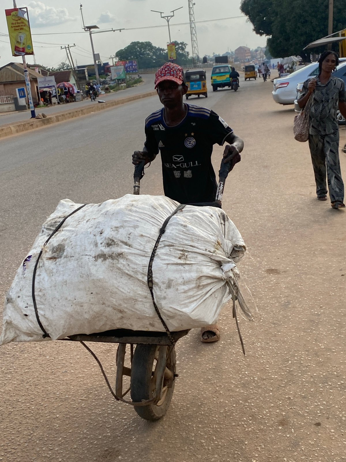 Afternoon street life and market activity in Sabon Tasha, Nigeria