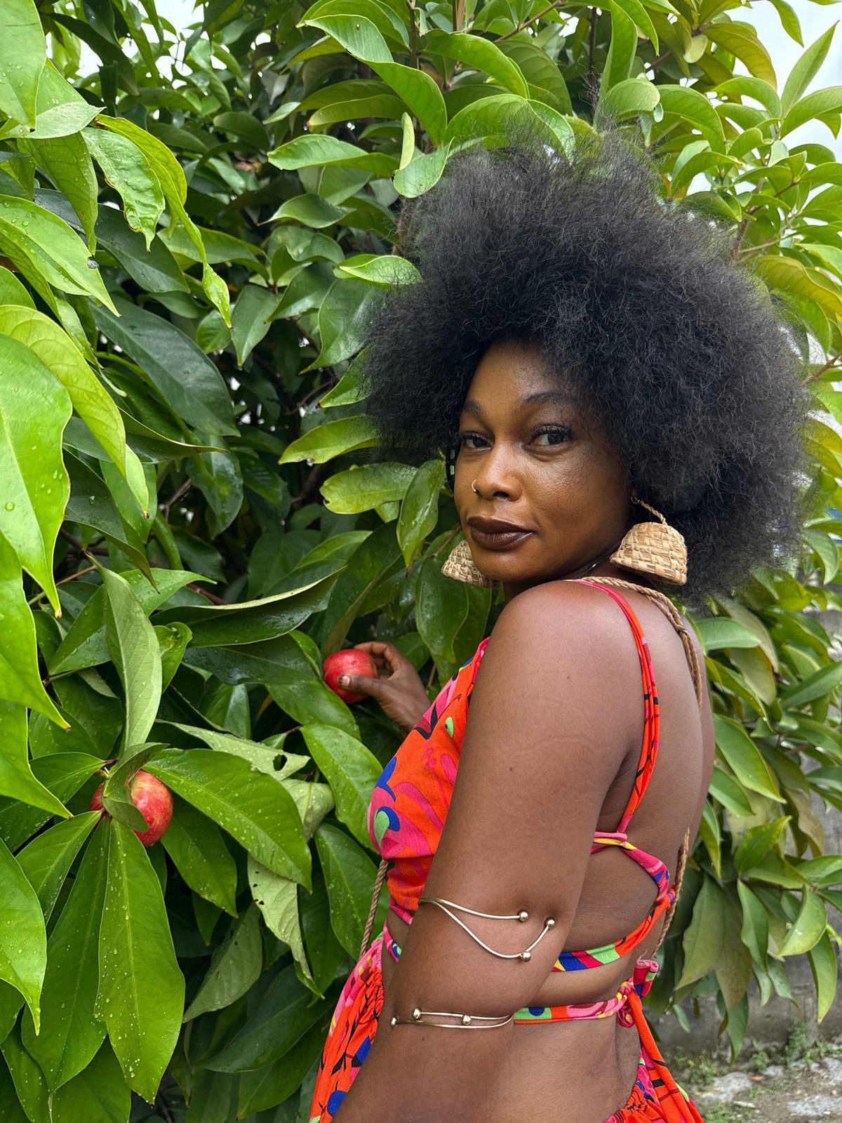 Woman spotted among fruit trees in Ado, Nigeria