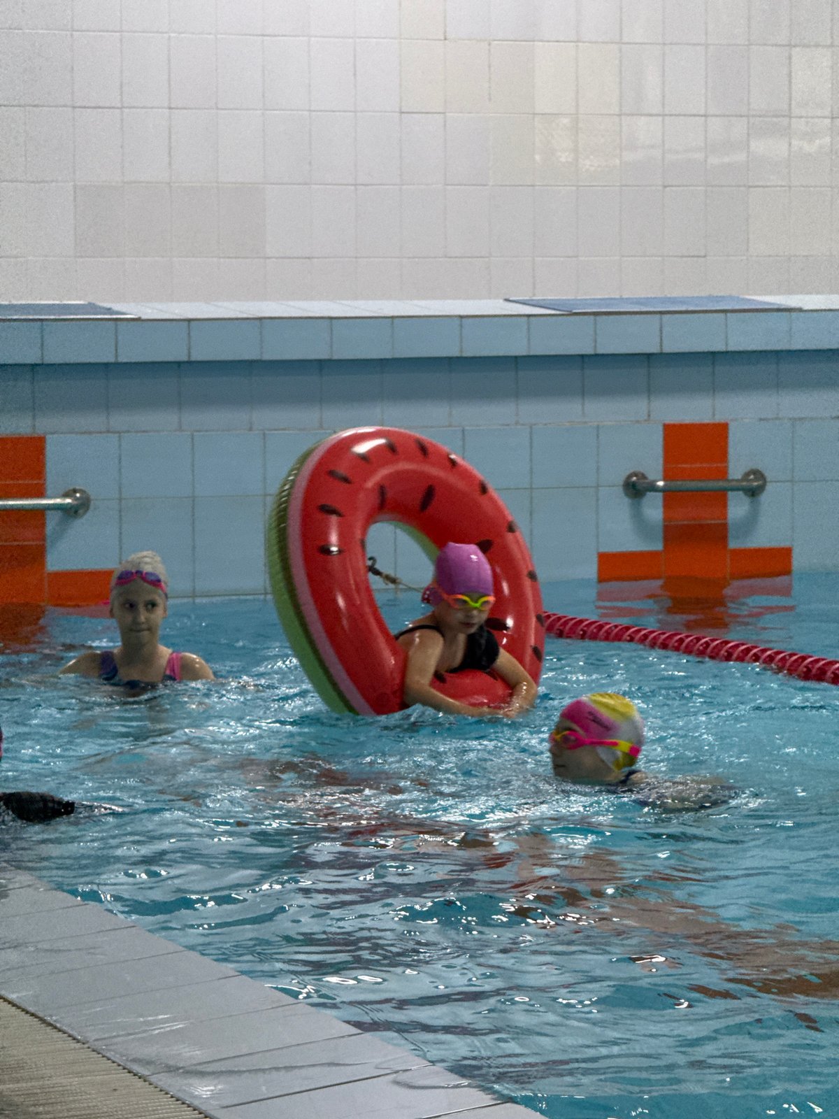 Kids' swim lesson in progress at Birobidzhan indoor pool