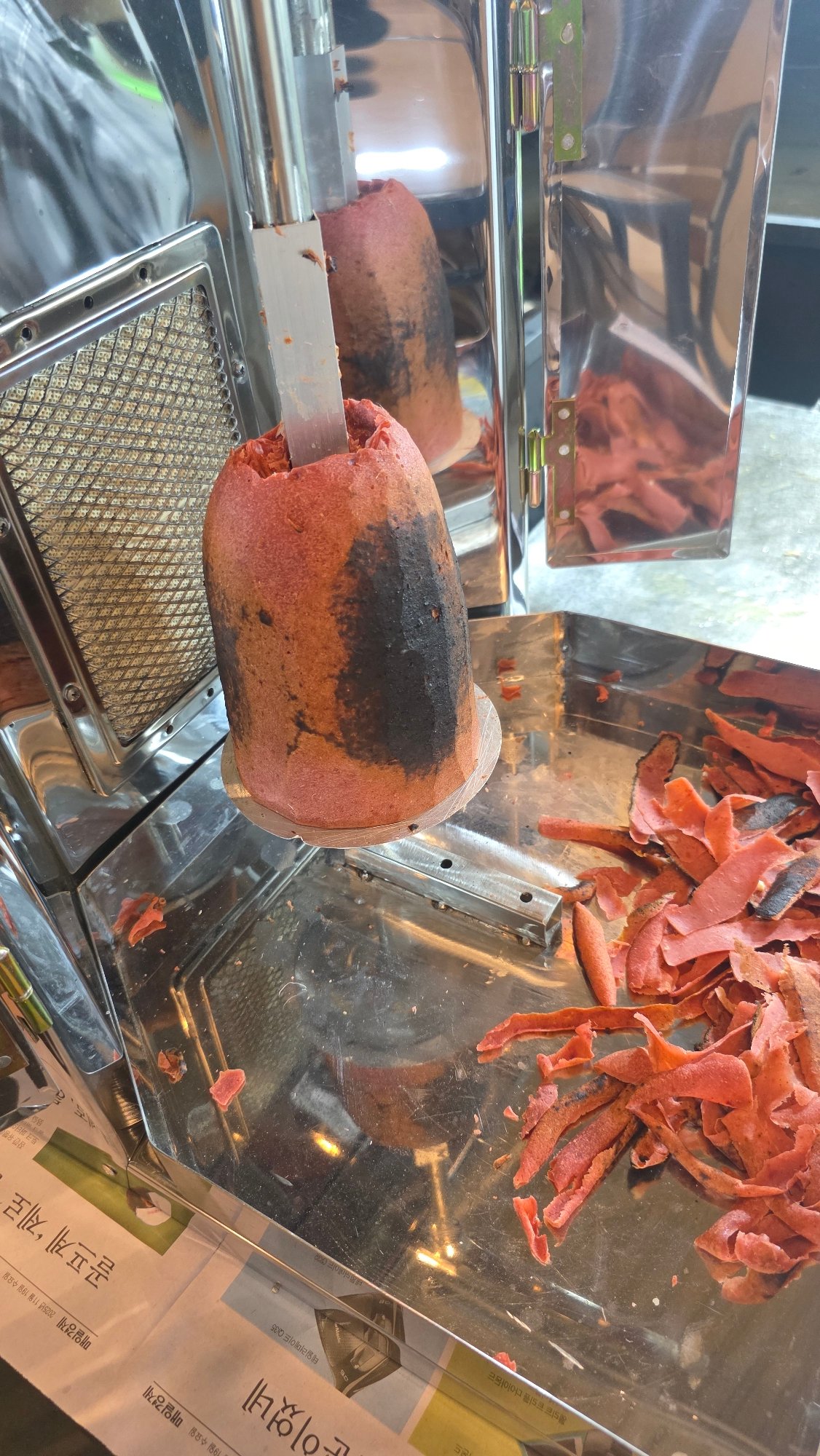 Street food vendor serves rolled wraps in Palohigeuh