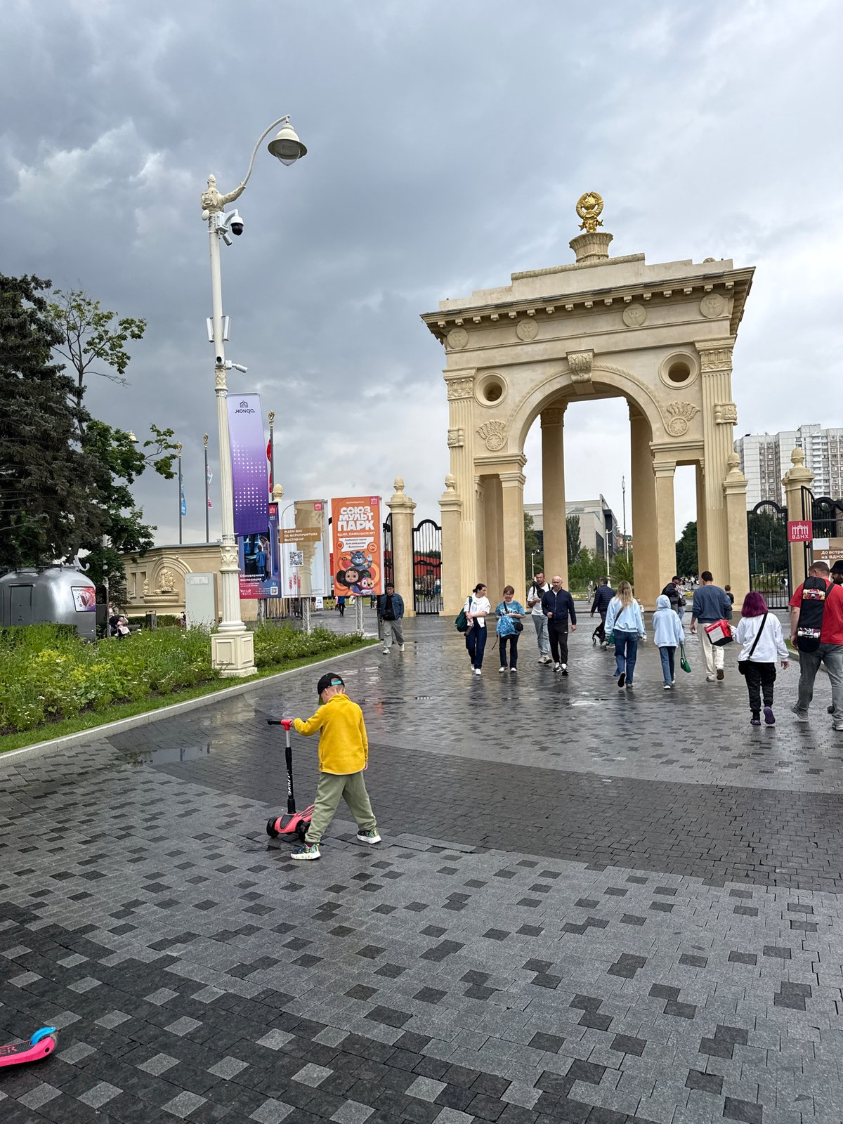Rainy afternoon wandering VDNKh's pavilions, fountains, and fairgrounds