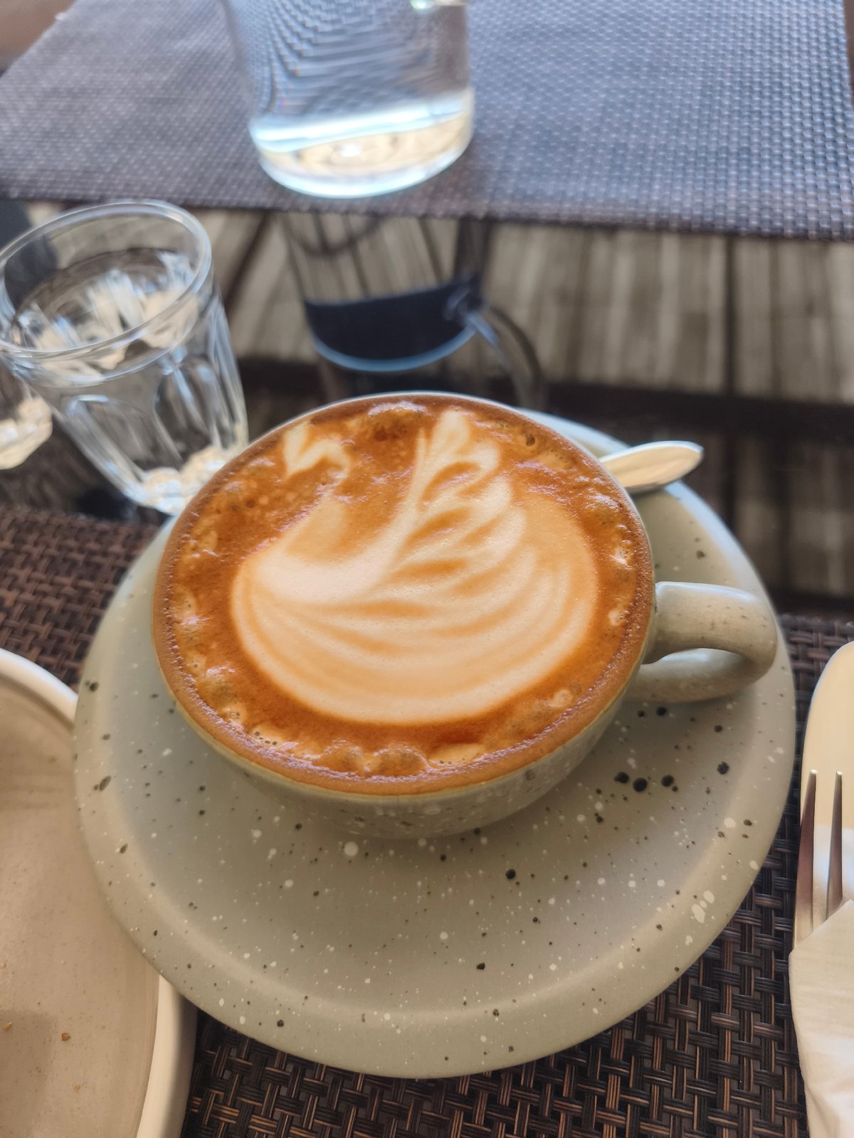 Café brunch in Baan Mae Nam: lattes, hash browns, and salmon plates