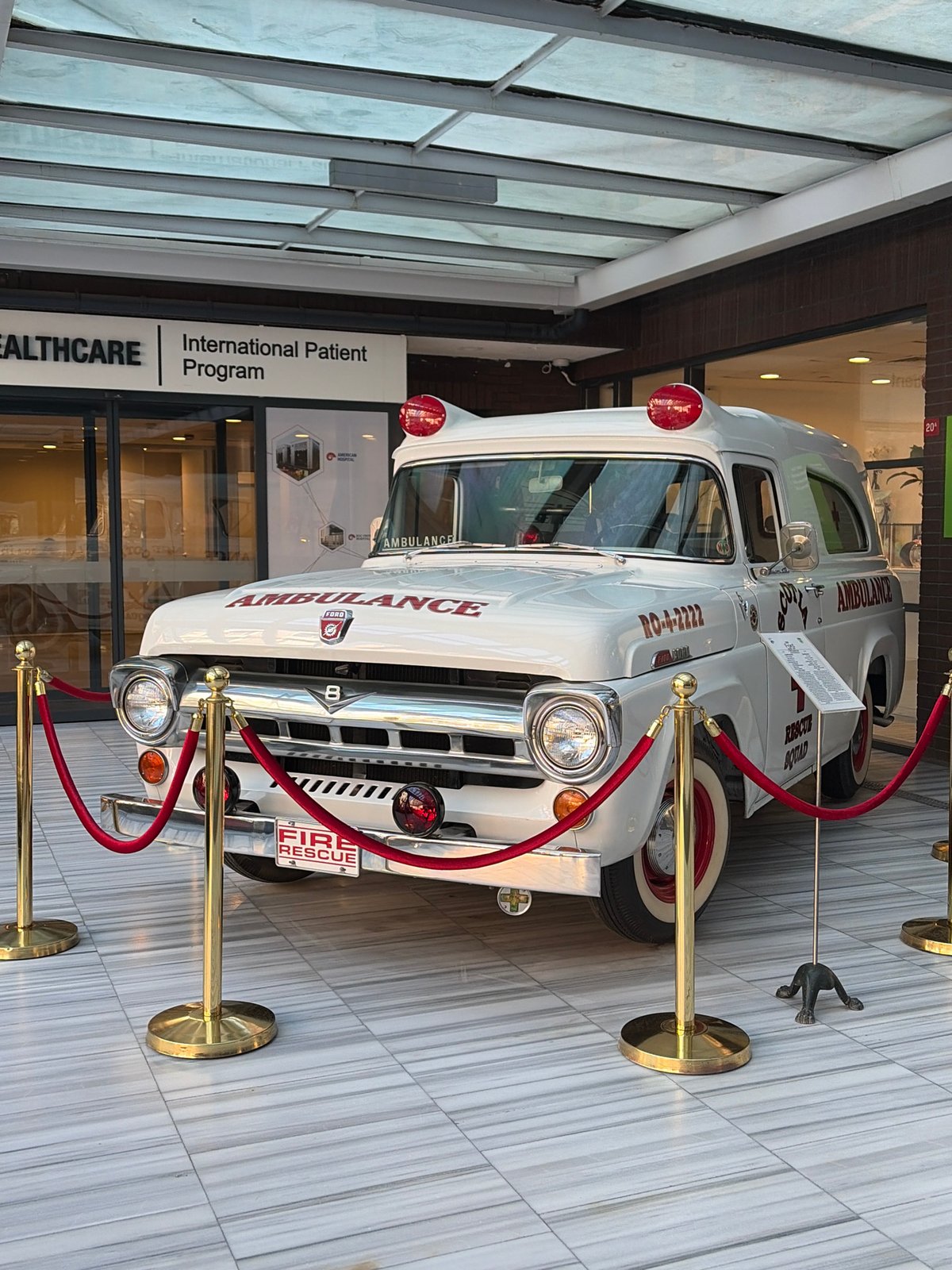 Vintage ambulance displayed in Turkish healthcare facility lobby