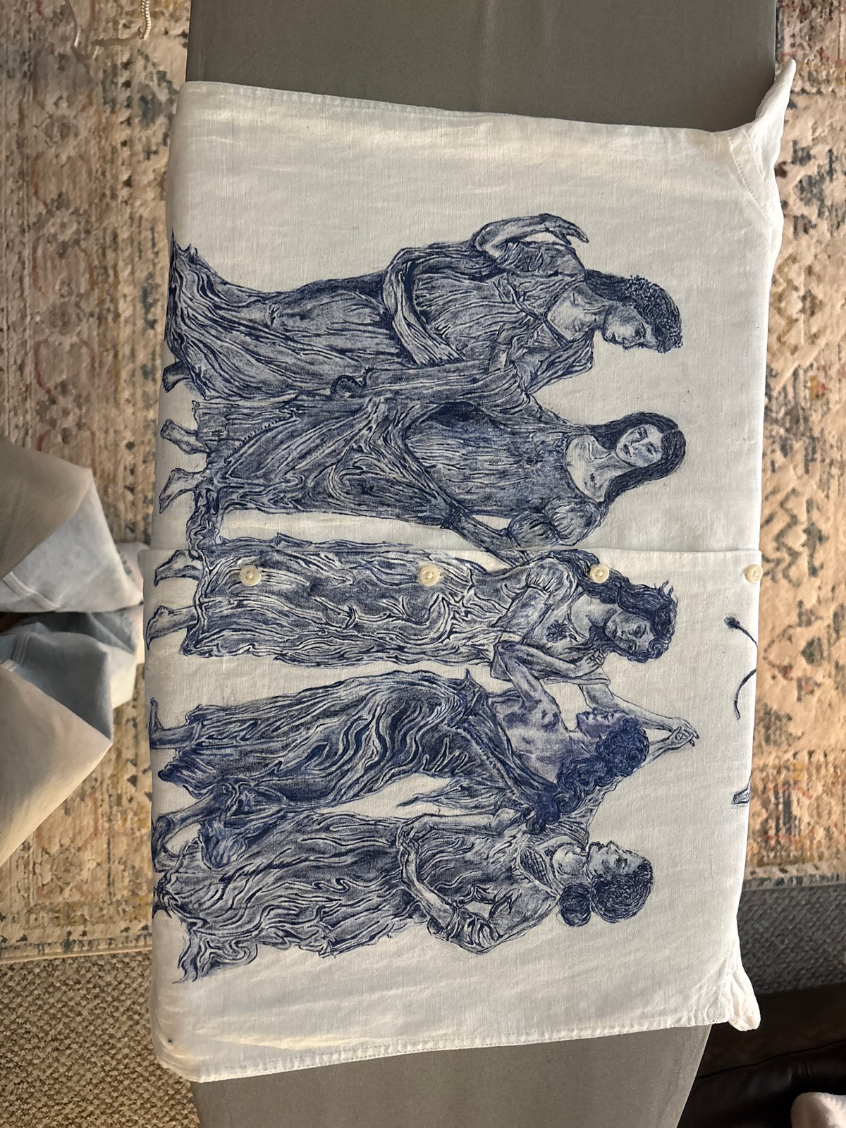 Classical-print linen shirt documented on ironing surface in Manchester