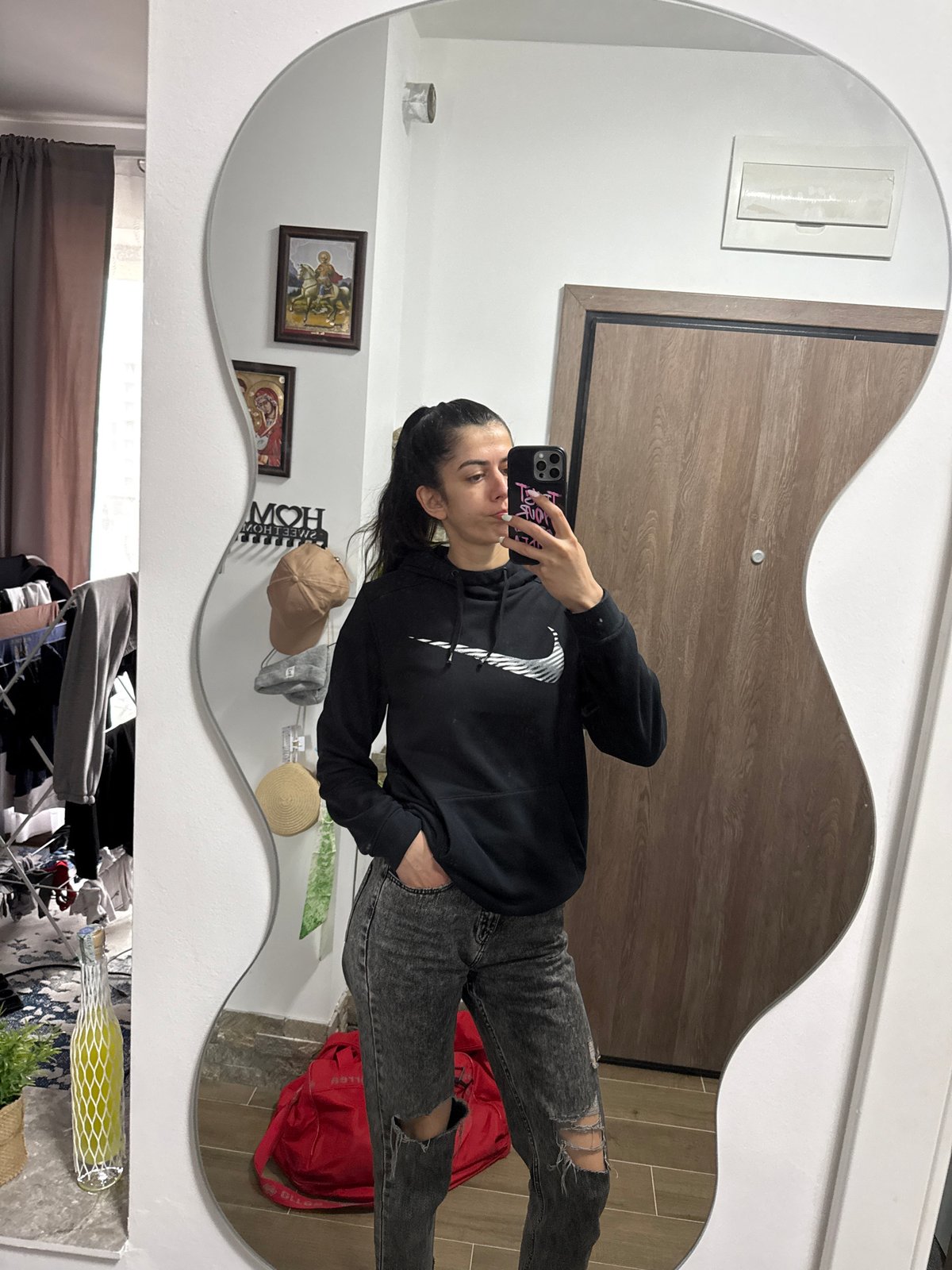 Woman takes mirror selfies in Sofia home early morning