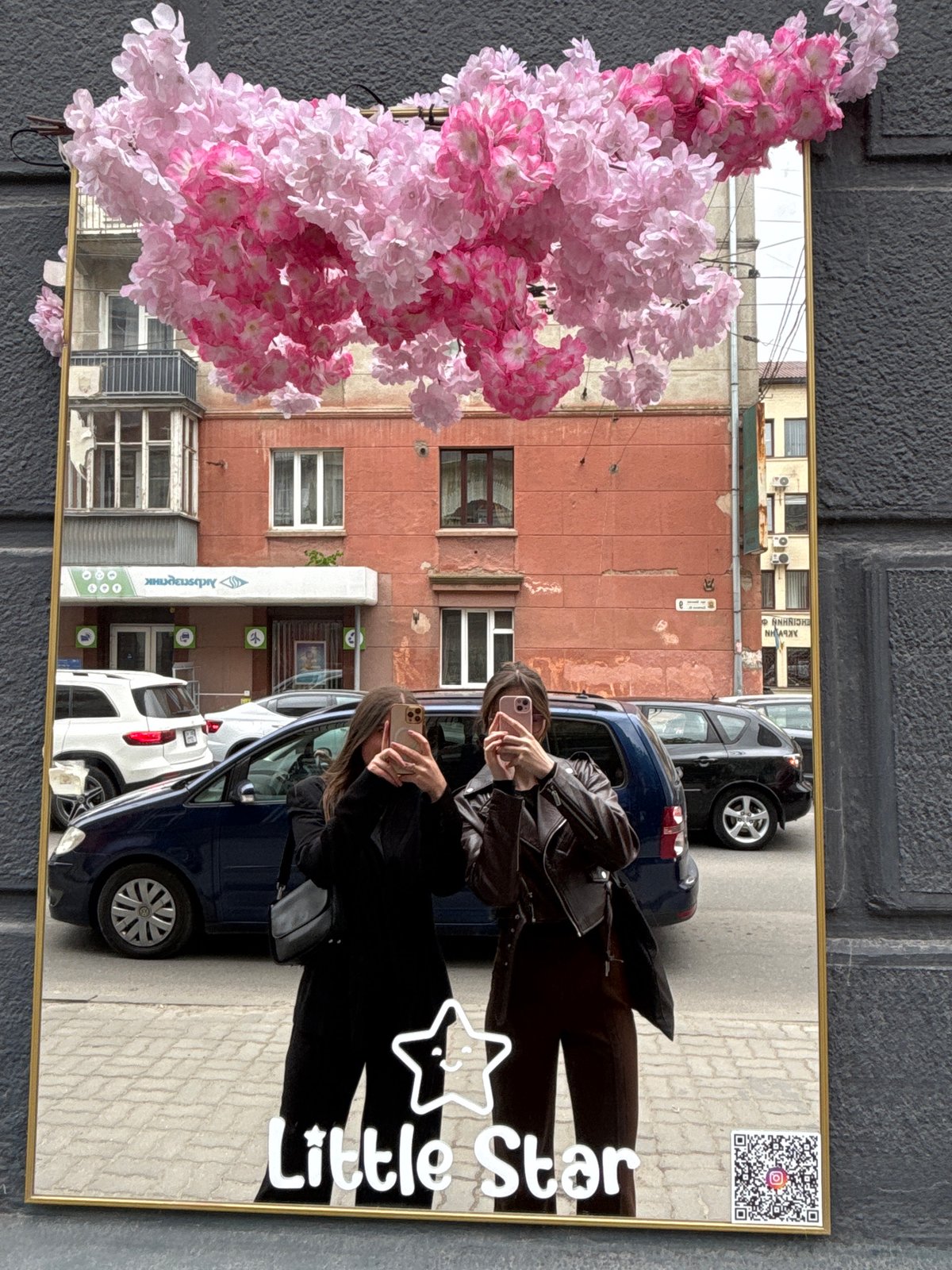 Street scenes captured featuring decorative mirror and red brick architecture