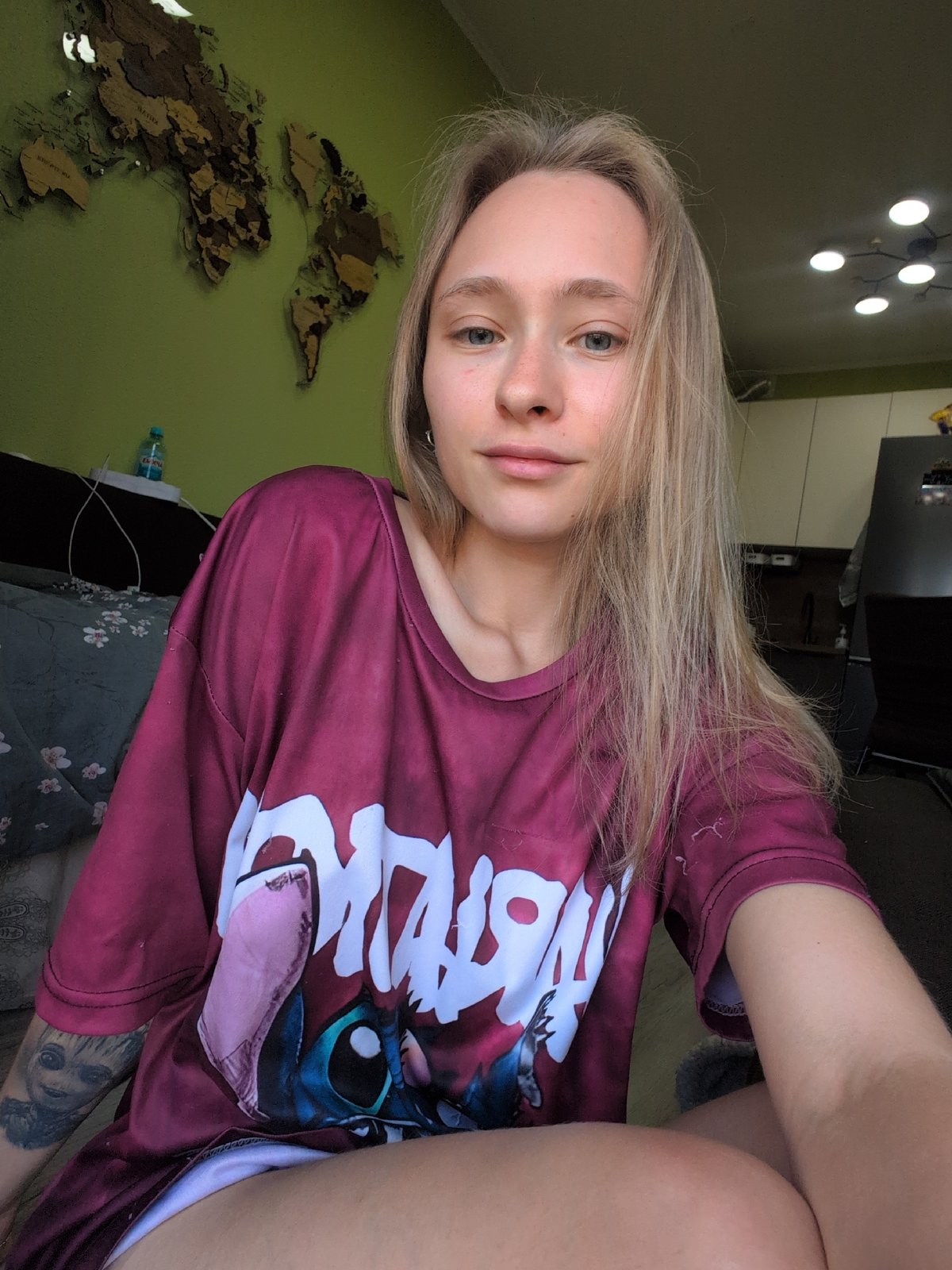 Casual indoor portrait featuring a Lilo & Stitch graphic tee