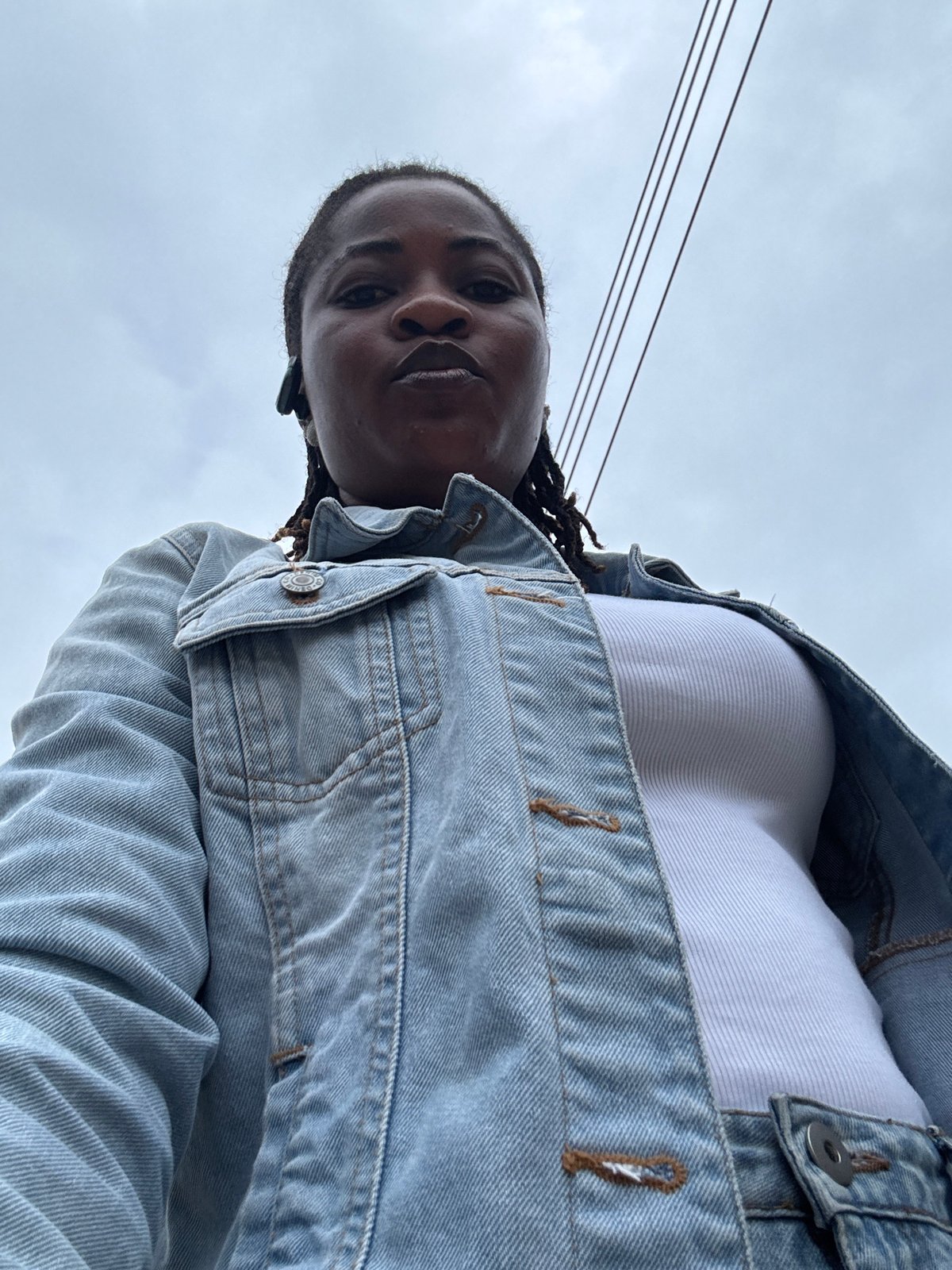 Morning selfie series in Ajara, Nigeria, overcast skies overhead