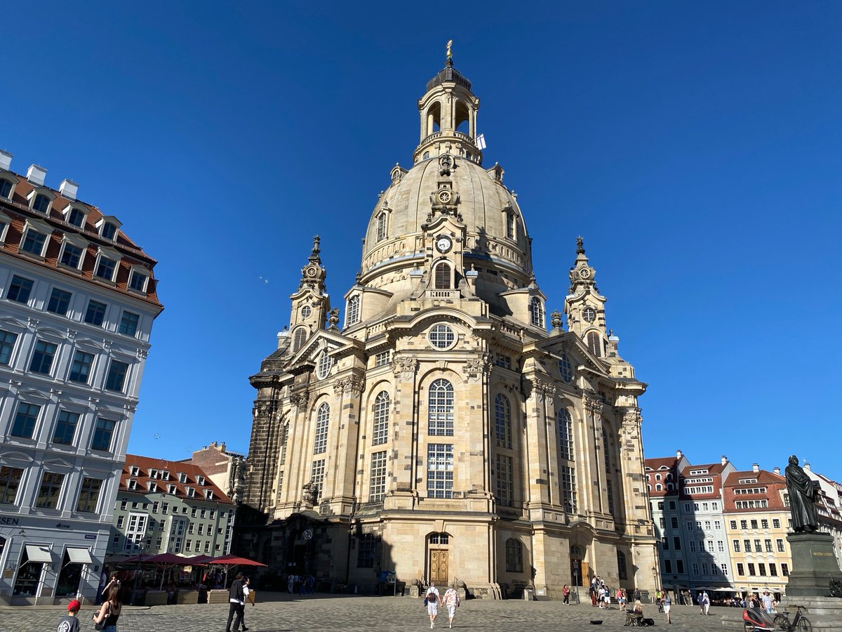 Tourist captures Dresden landmarks during afternoon walking tour