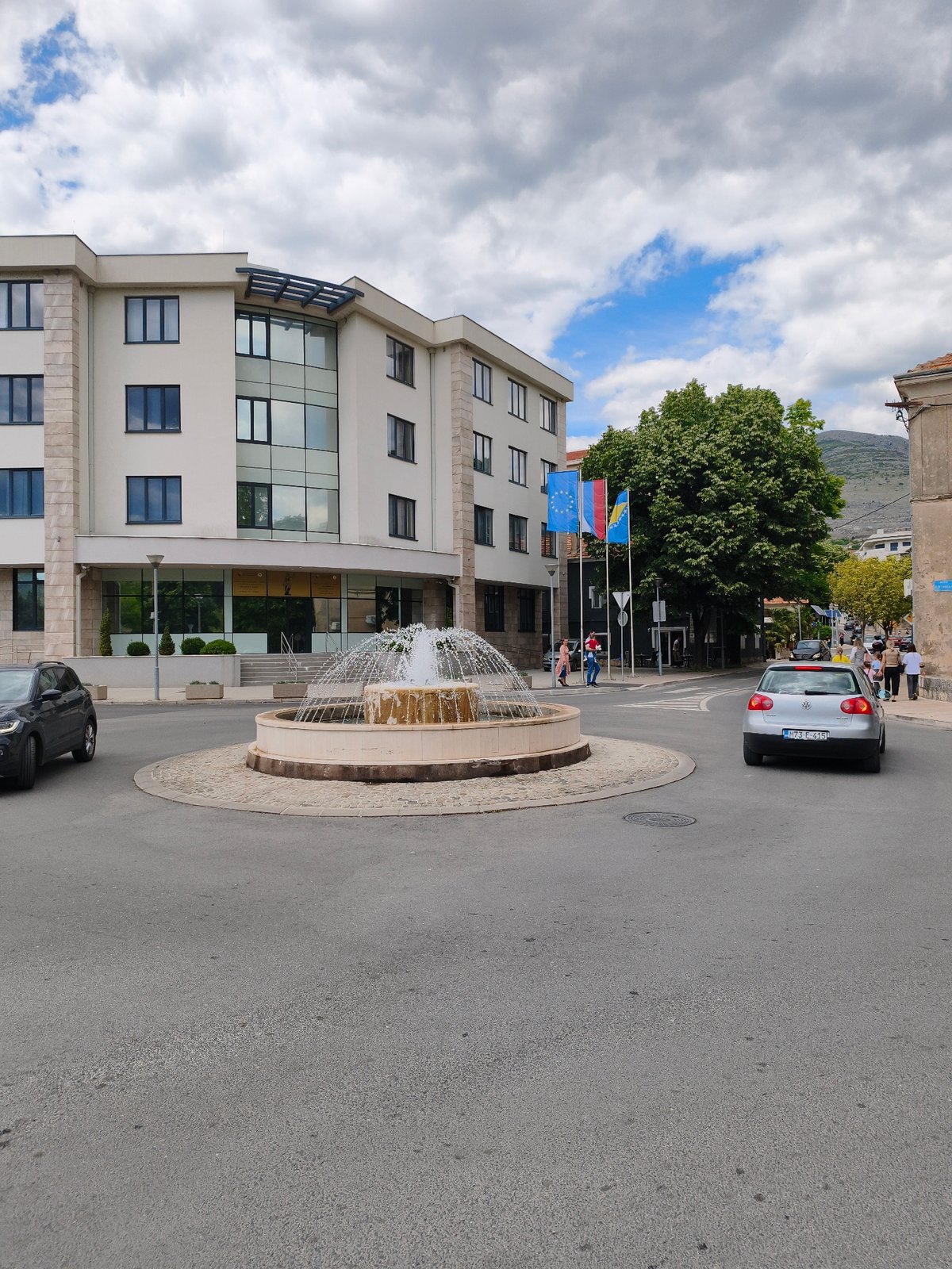 Trebinje street scenes captured including roundabout fountain and park