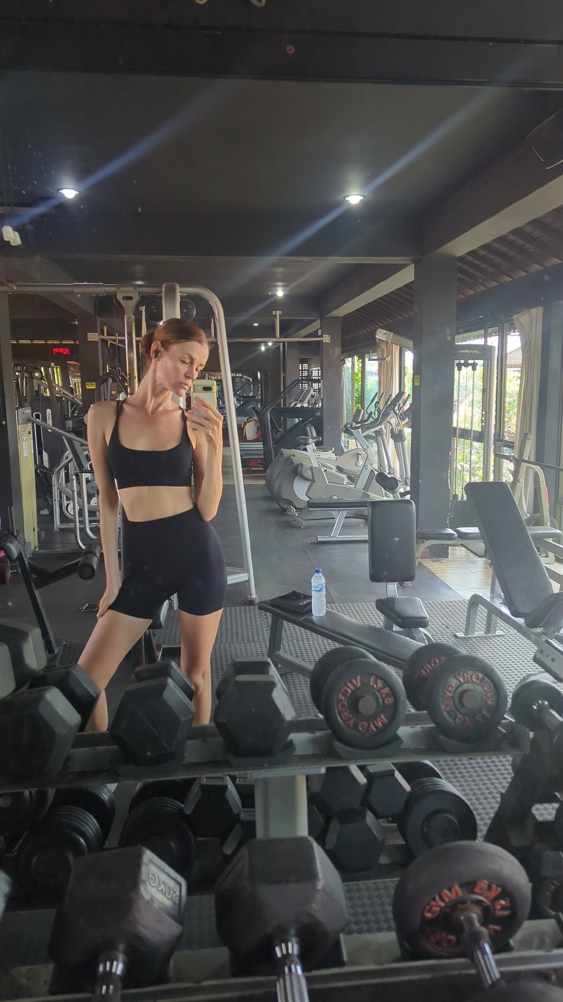 Woman takes gym selfies in Mengwi, Indonesia early morning