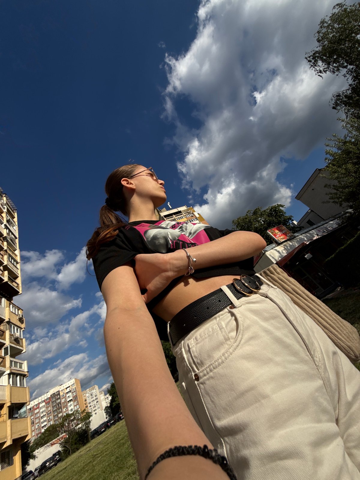 Woman photographed outdoors in Sofia on sunny afternoon