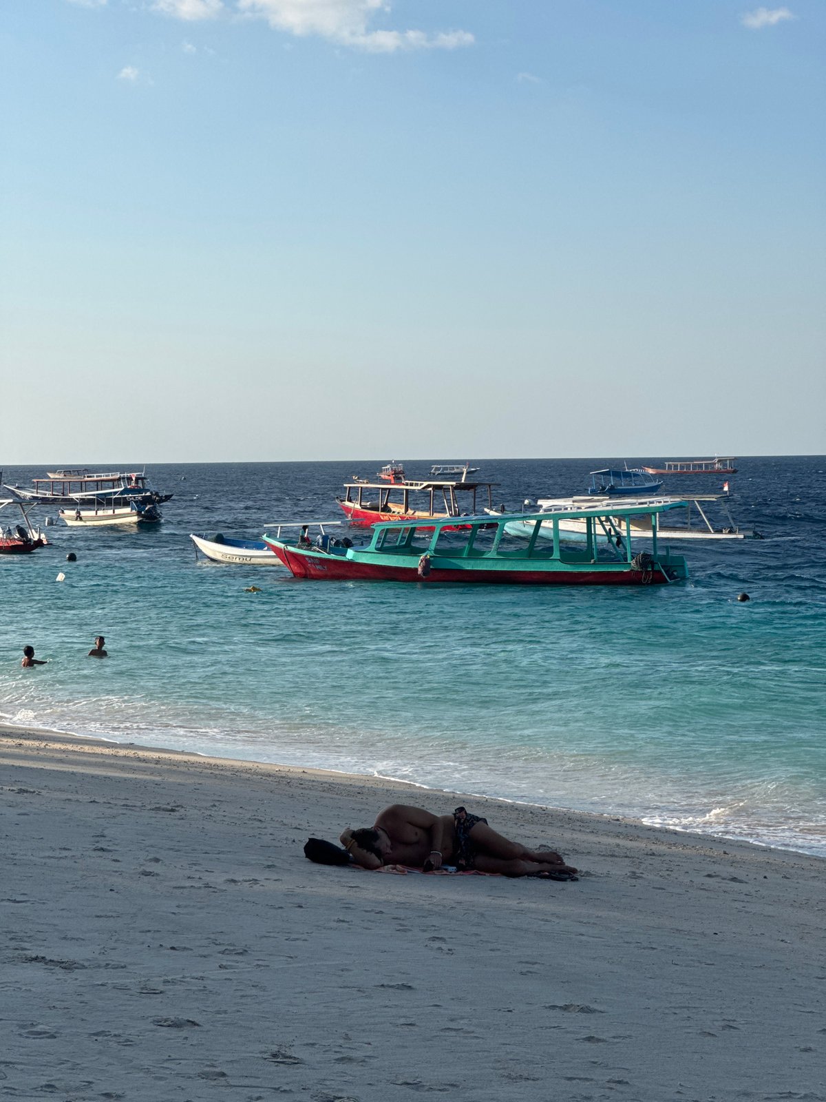 Lazy morning on a Lombok beach, shells and turquoise water