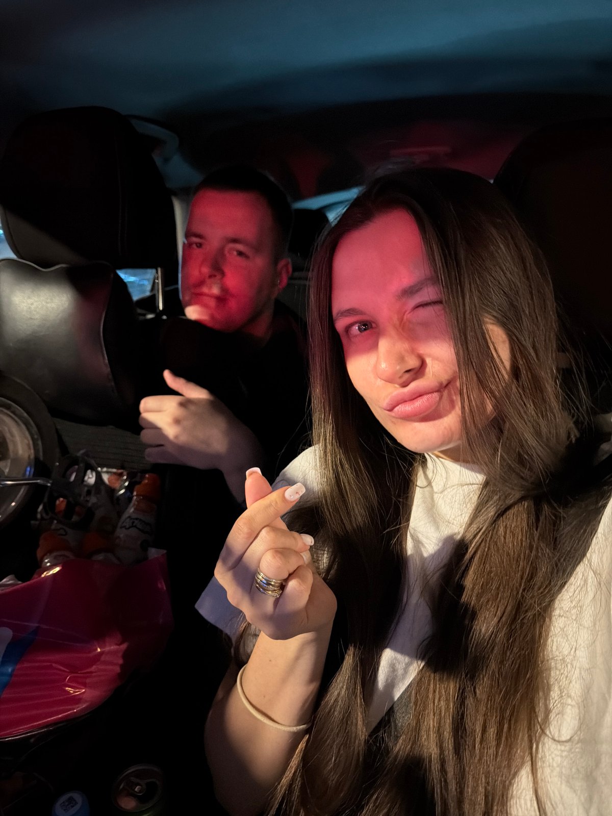 Woman takes selfies while night driving in Moscow