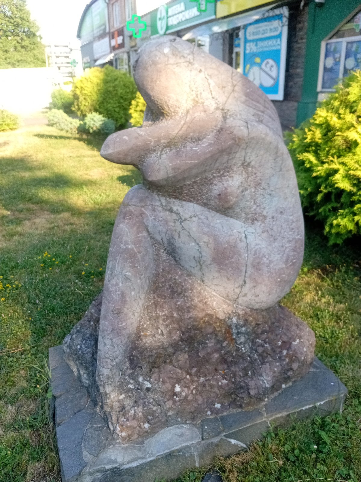 Public square in Tiachiv with fountain and stone sculptures