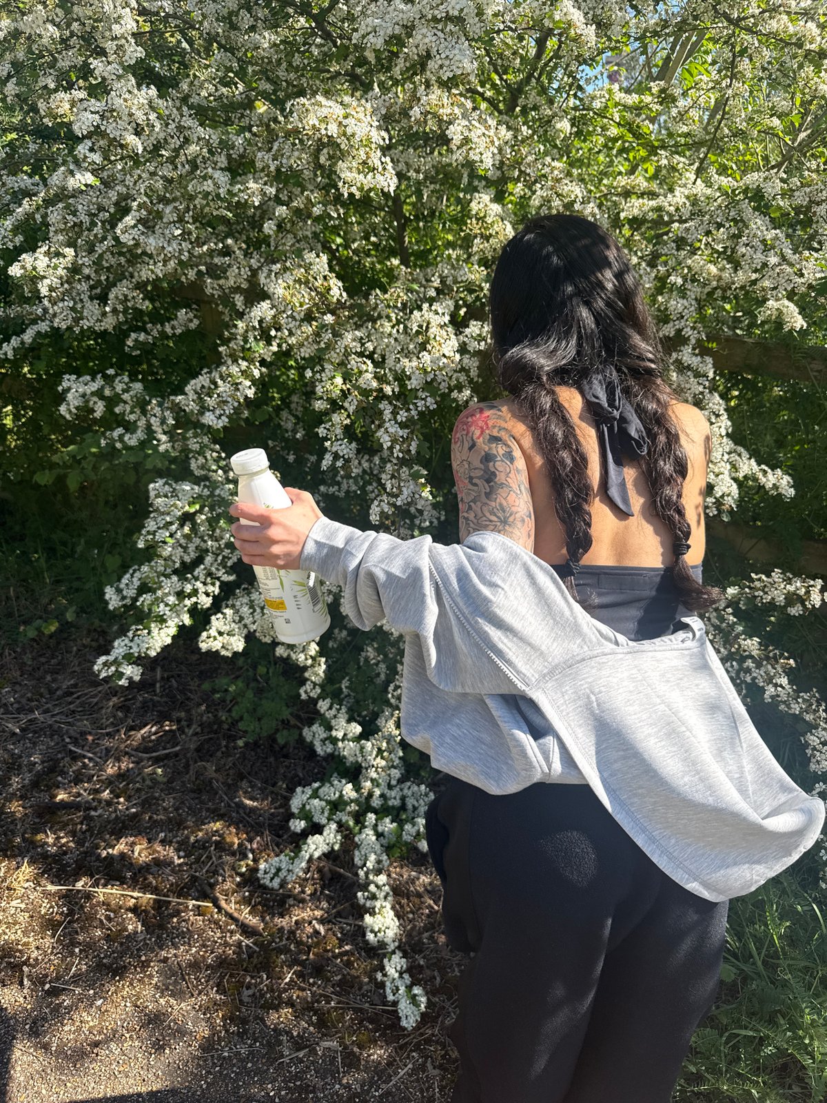 Person documents spring blooms and architecture during London afternoon walk