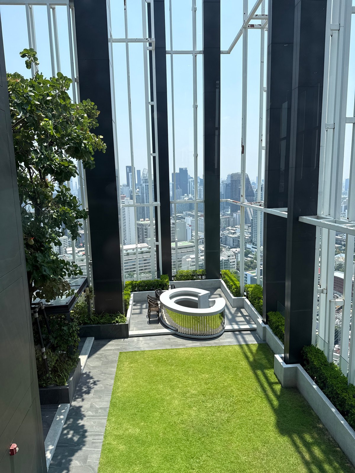 Rooftop garden view captured overlooking Bangkok cityscape