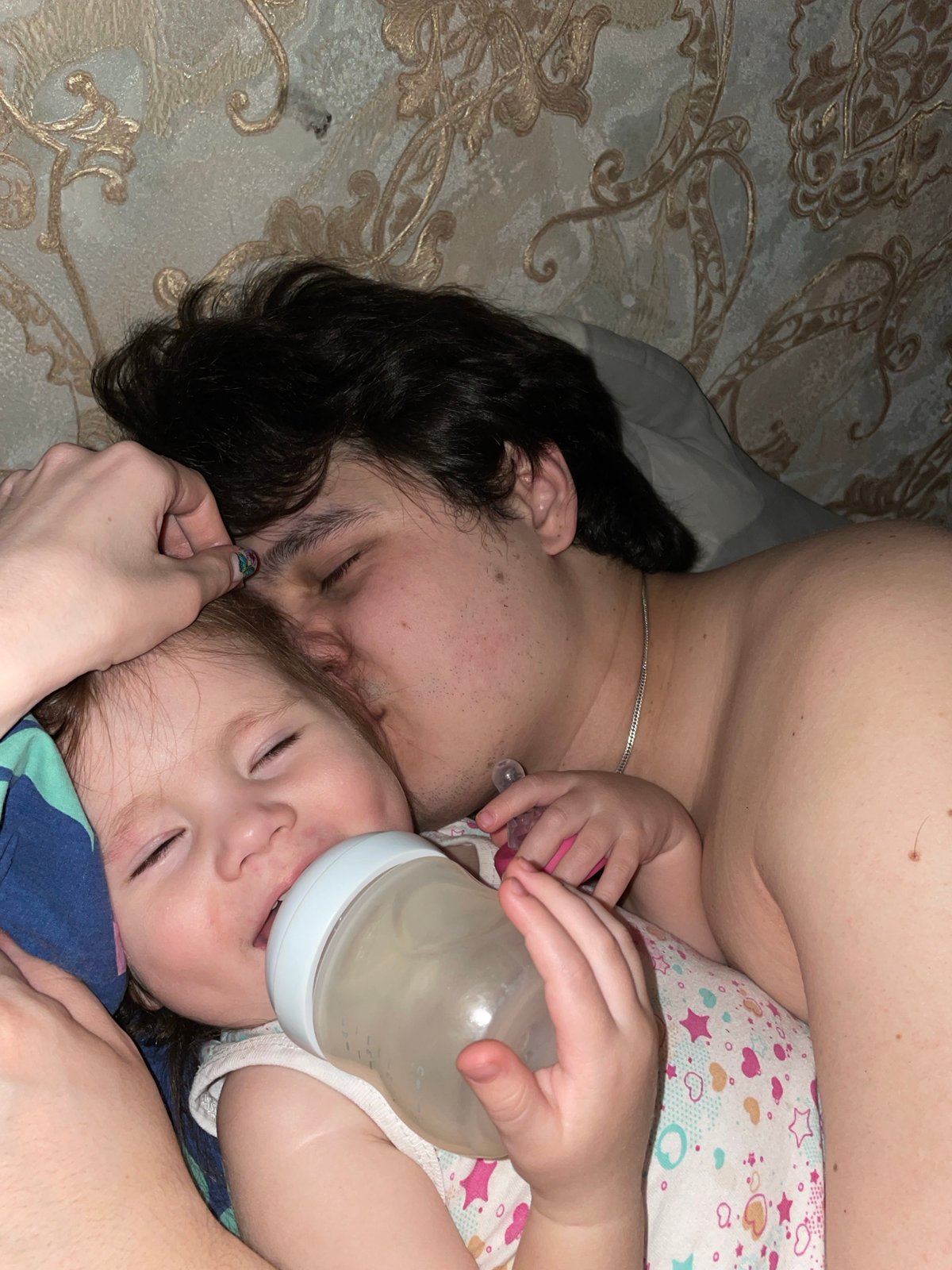 Family shares quiet bedtime moment in Izhevsk home
