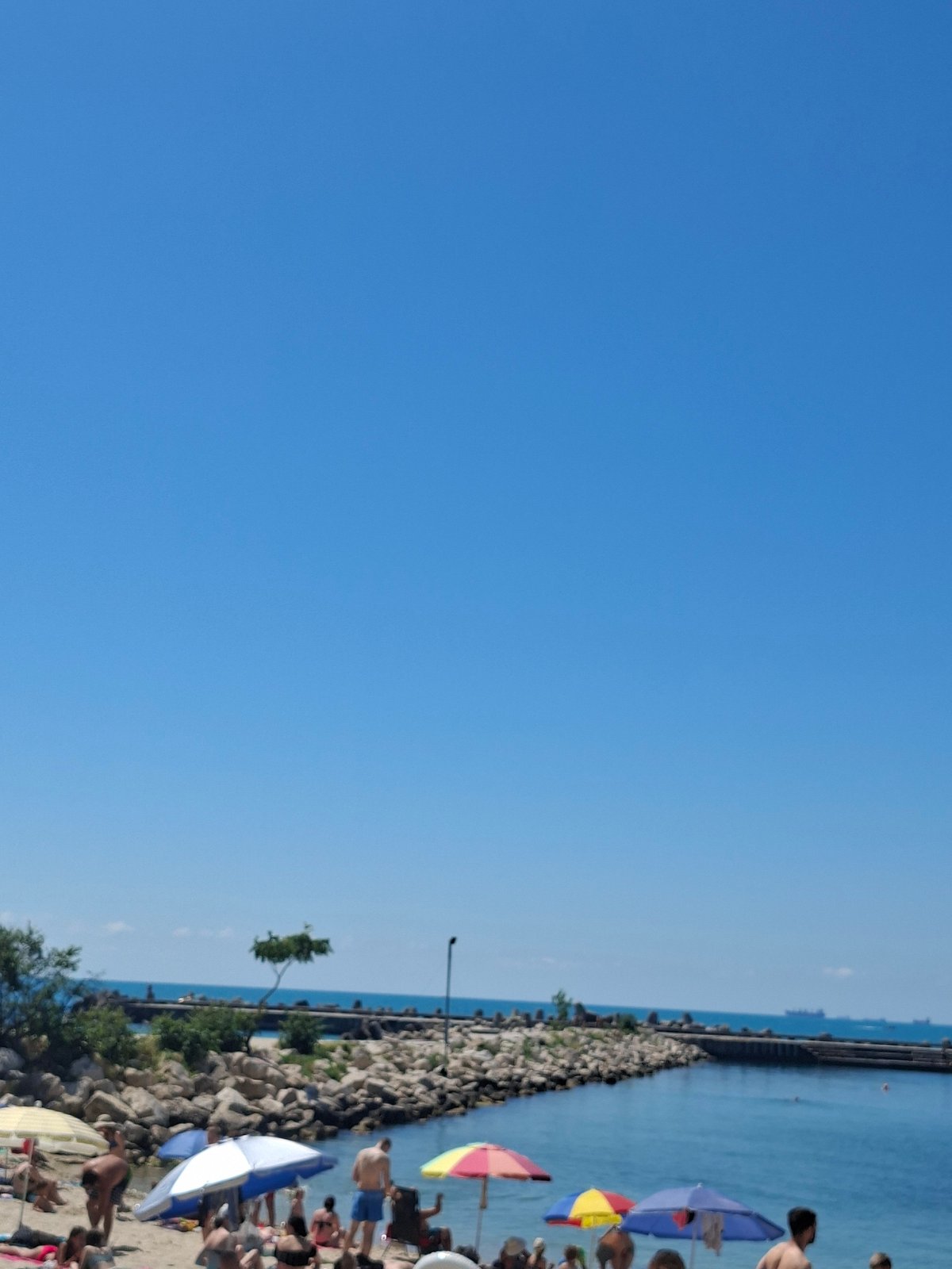 Summer day at Varna's Black Sea beach: water sports, food, sun.