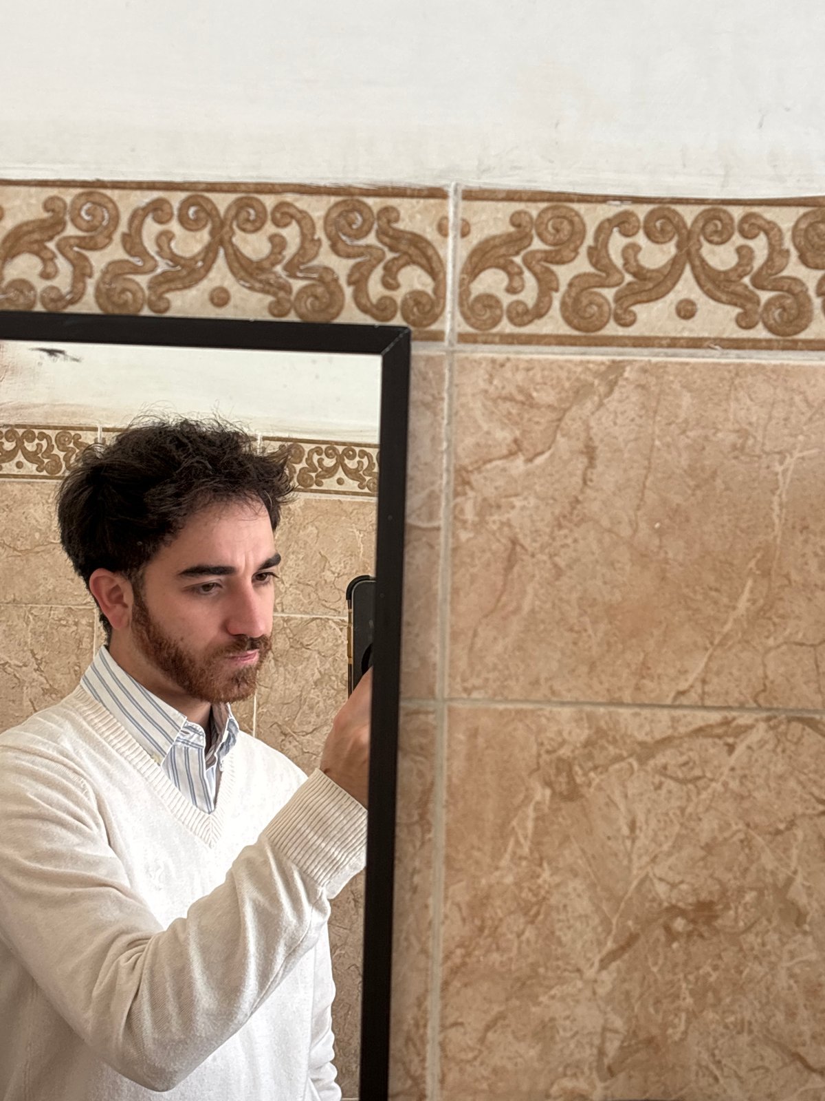 Man takes bathroom mirror selfies in Puebla, Mexico