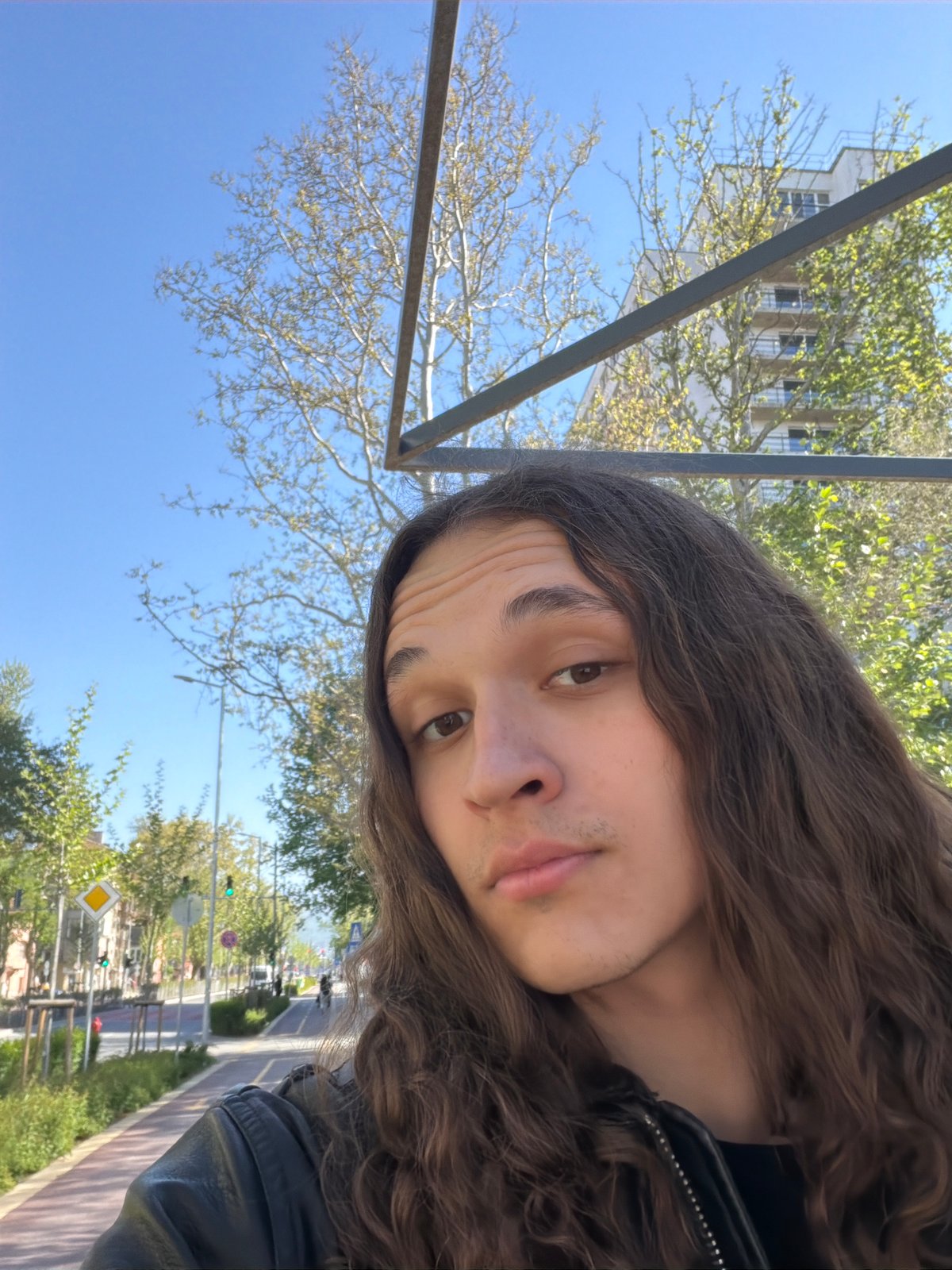 Tourist takes outdoor selfies in sunny Plovdiv, Bulgaria