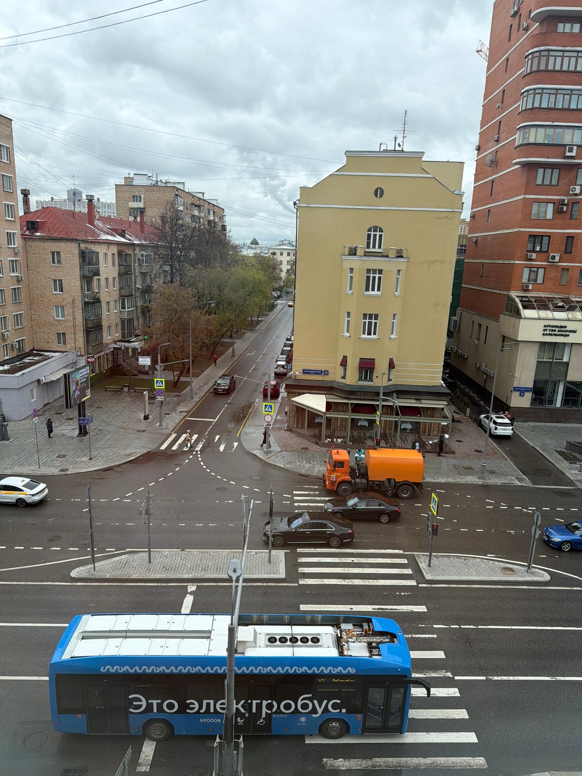 Moscow intersection bustling with traffic under overcast skies