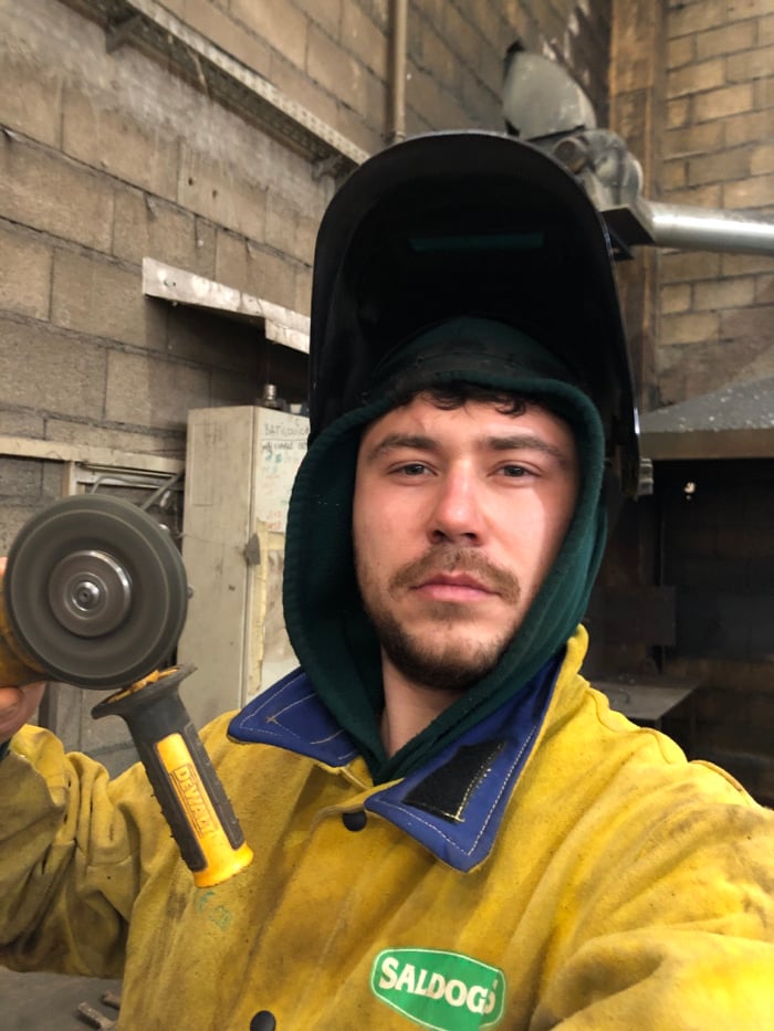Industrial worker documented at Čeluga workshop facility