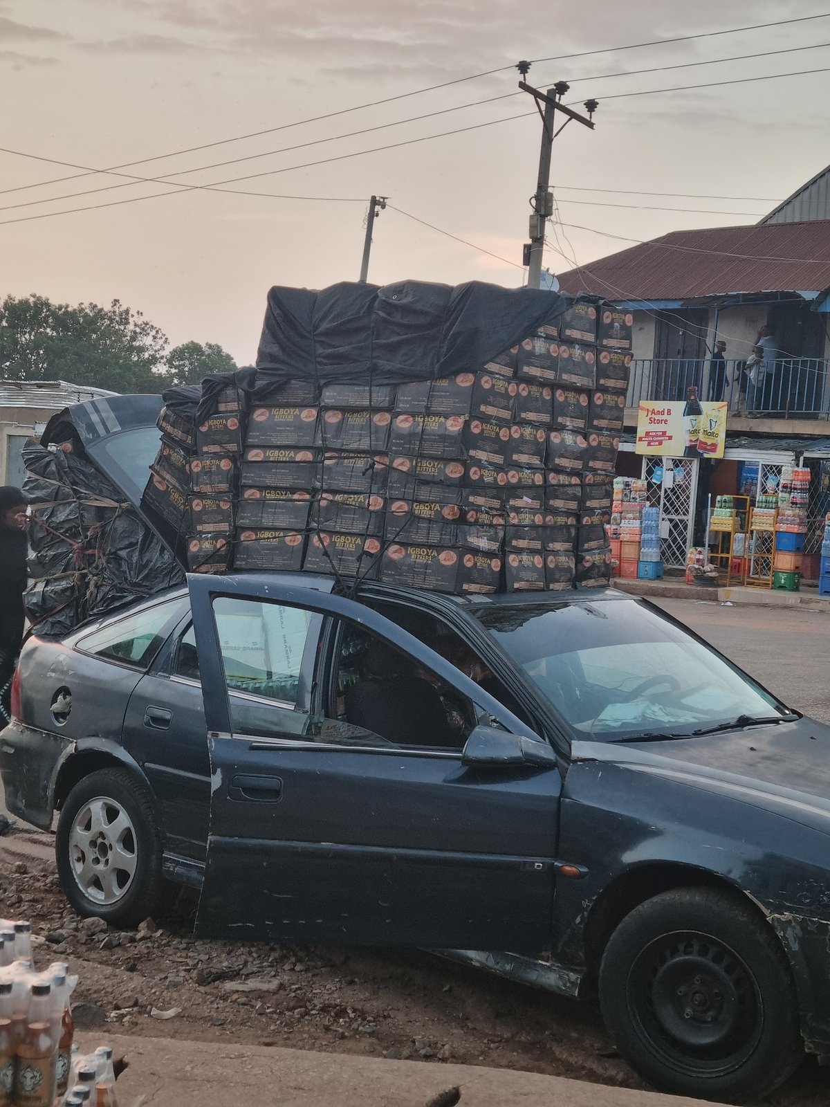 Commercial vehicles heavily loaded with goods observed in Jos, Nigeria
