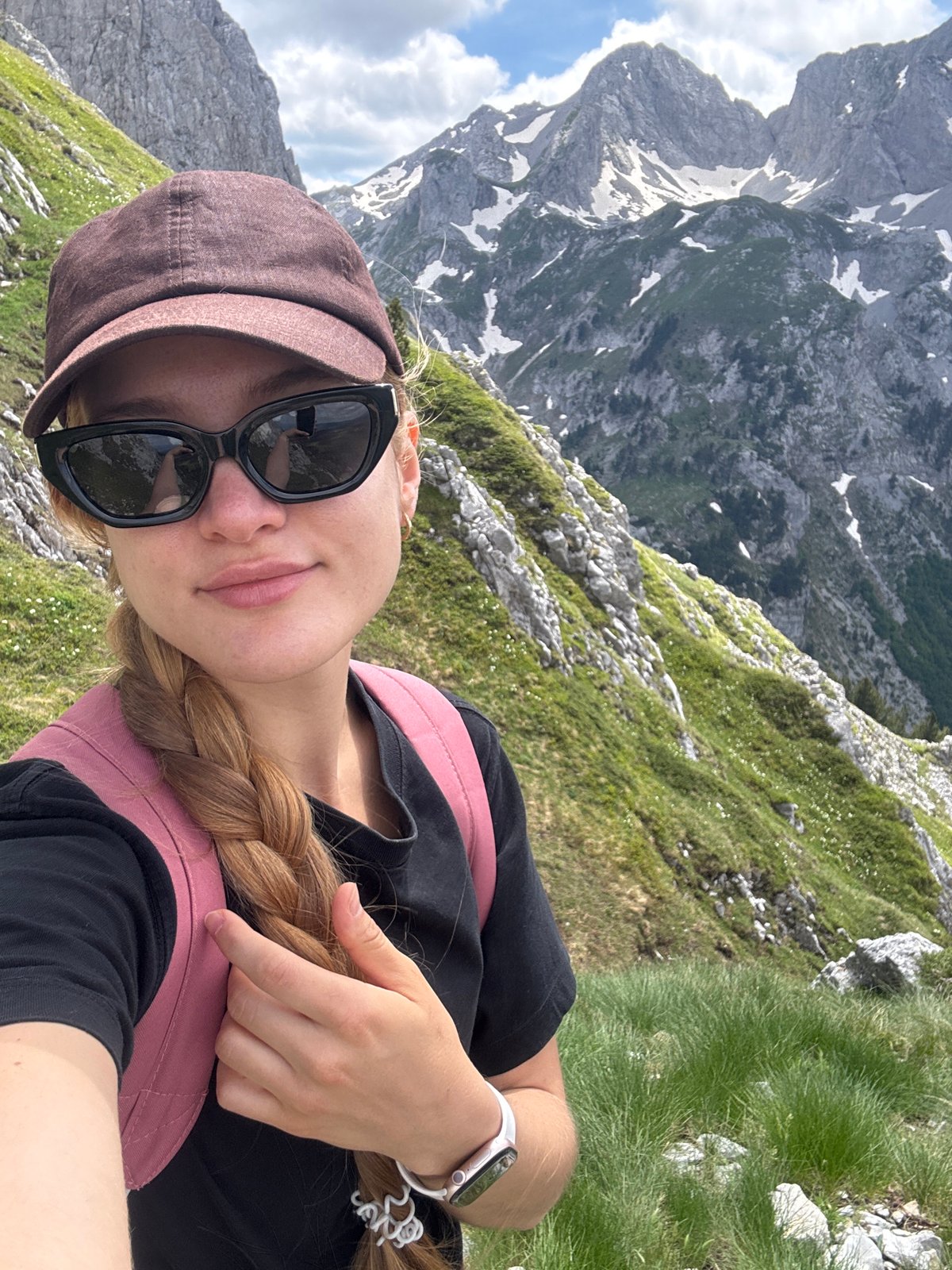 Hikers photograph mountain trek with dog near Jošanica, Montenegro