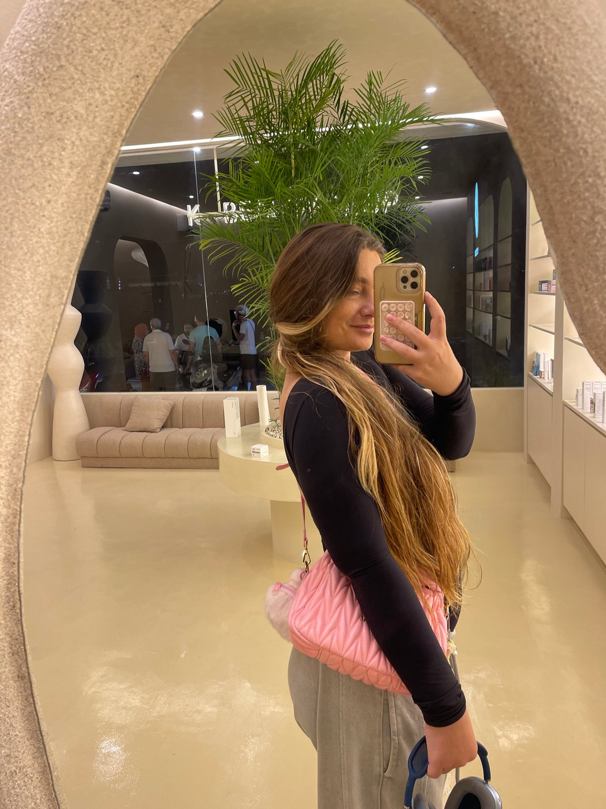 Mirror selfie session in a modern Mengwi retail space