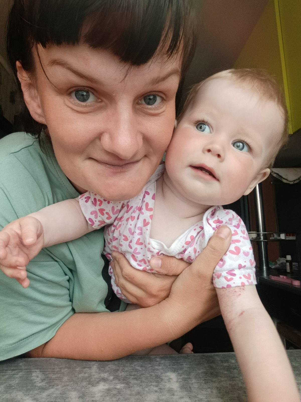 Woman holds baby in Фоки, Russia